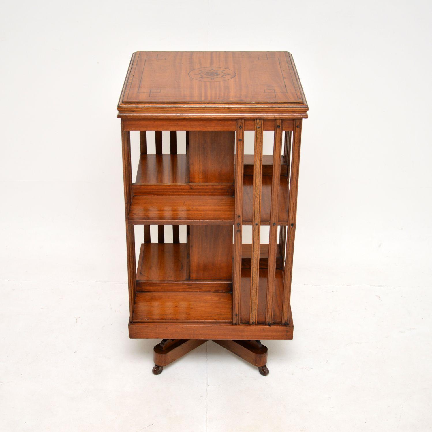 A lovely antique Edwardian inlaid satin wood revolving bookcase. This was made in England, it dates from around 1900-1910.

The quality is fantastic, this is a useful and beautifully designed item. The satin wood top has gorgeous inlays of walnut in