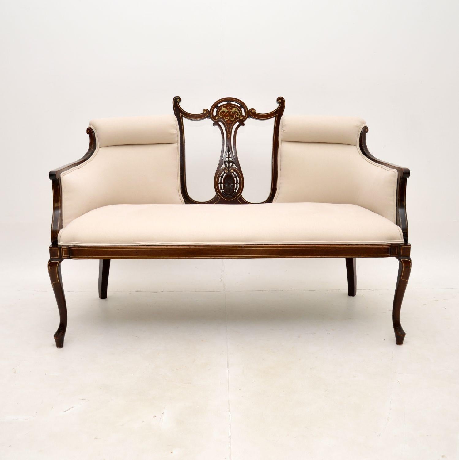 A fantastic antique Edwardian settee. This was made in England, it dates from the 1890-1900 period.

The quality is outstanding, this is beautifully designed and is a very useful size. The frame has elegant curves, it is really well made, sturdy and