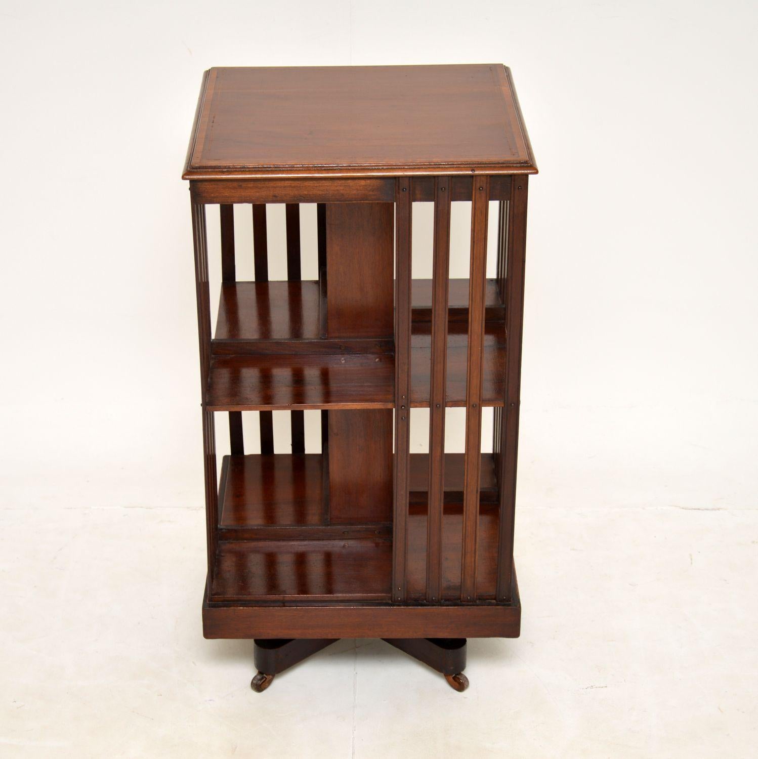 A lovely original antique Edwardian revolving bookcase. This was made in England, it dates from around the 1900-1910 period.

It is of excellent quality and is a very useful item. It is finished on all four sides with open bookshelves and vertical