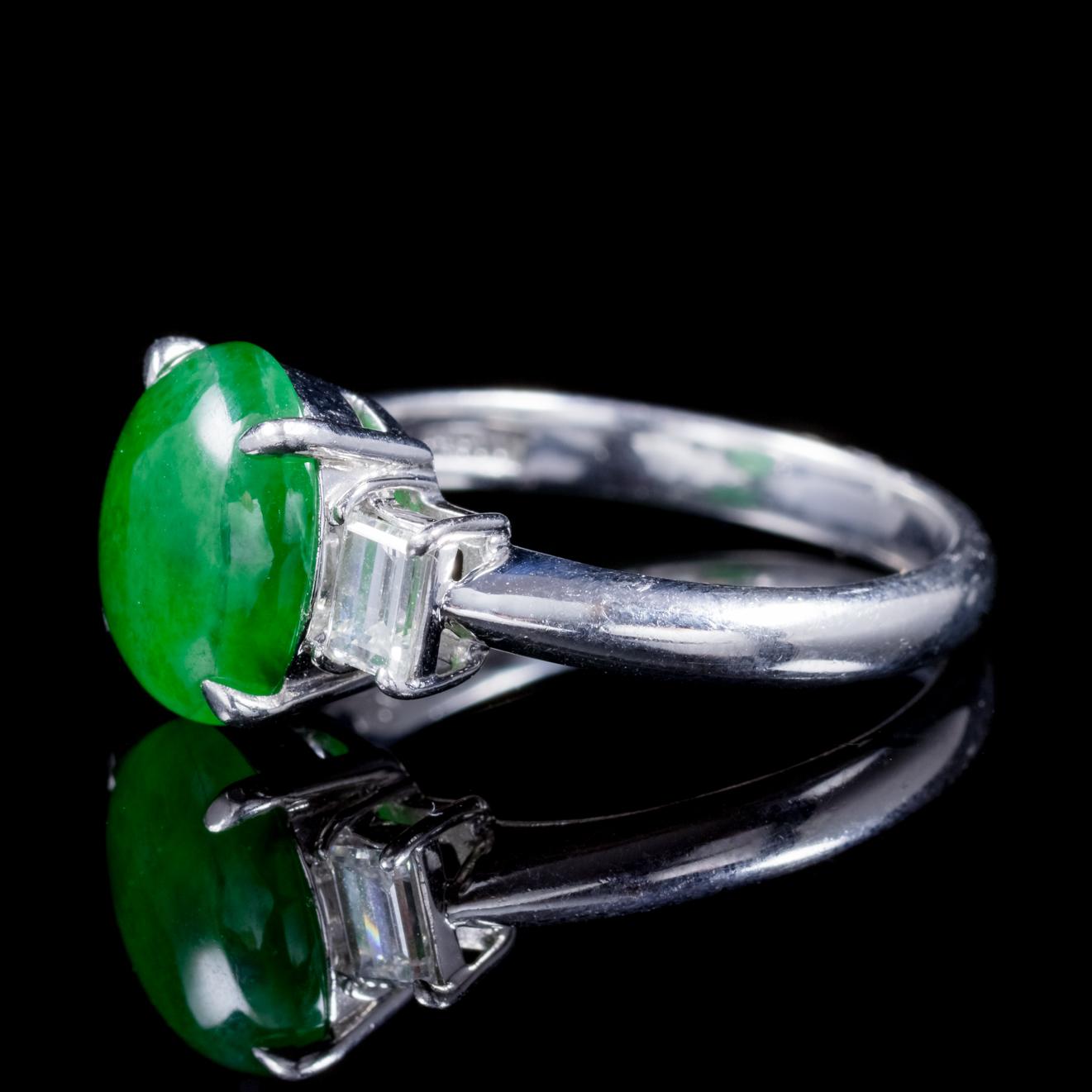 A fabulous antique Edwardian Platinum trilogy ring C. 1915, adorned with a lovely 2.65ct Jade stone in the centre flanked by two emerald cut Diamonds. 

Jade is considered the ultimate ‘Dream Stone’ and has been admired in ancient cultures