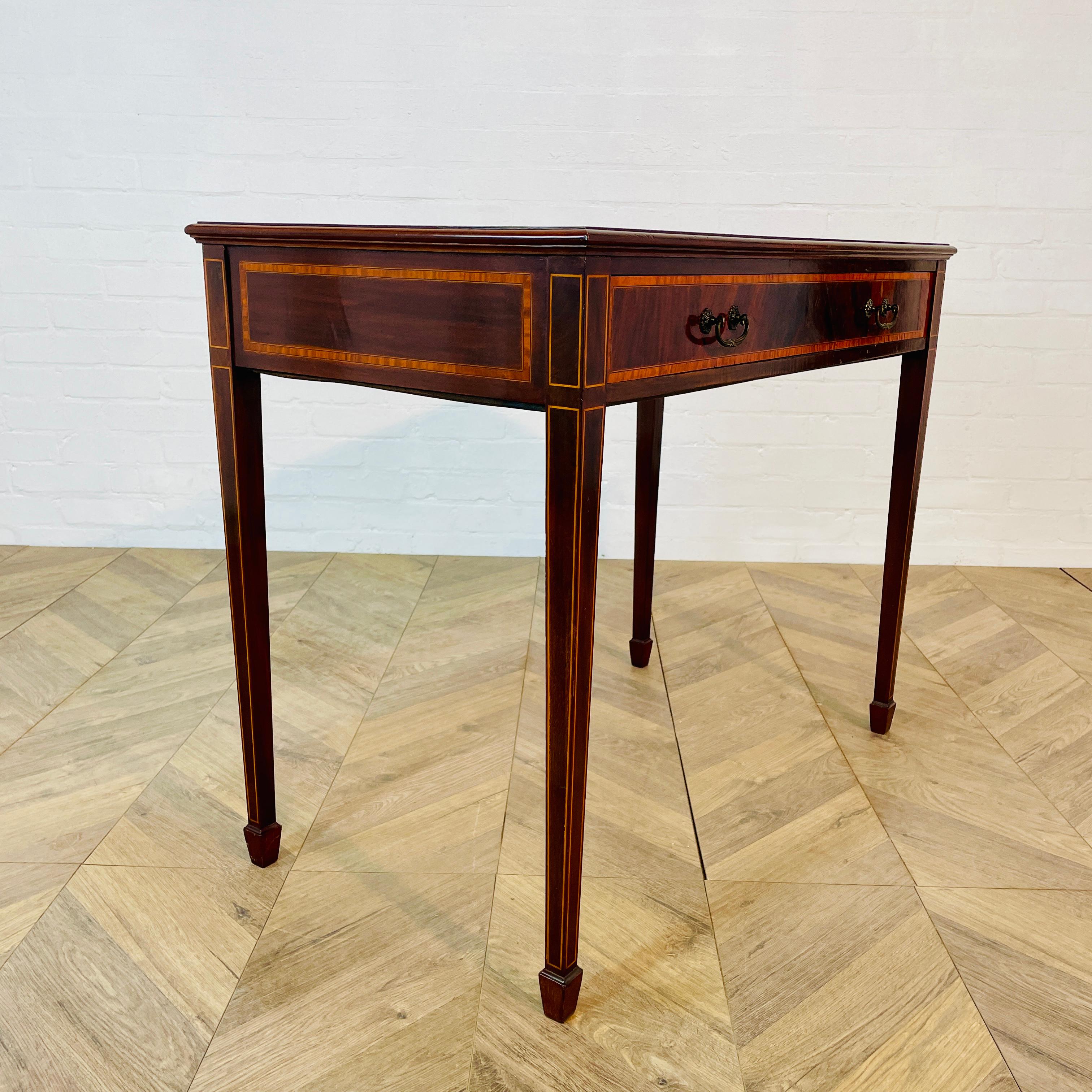 A Beautiful Antique Single Drawer Desk. circa 1910s.

Made from Mahogany and sitting on tapered legs, the table has good colour and patination and nice proportions.

Structurally, the table is good condition, with the drawer moving as it should, and