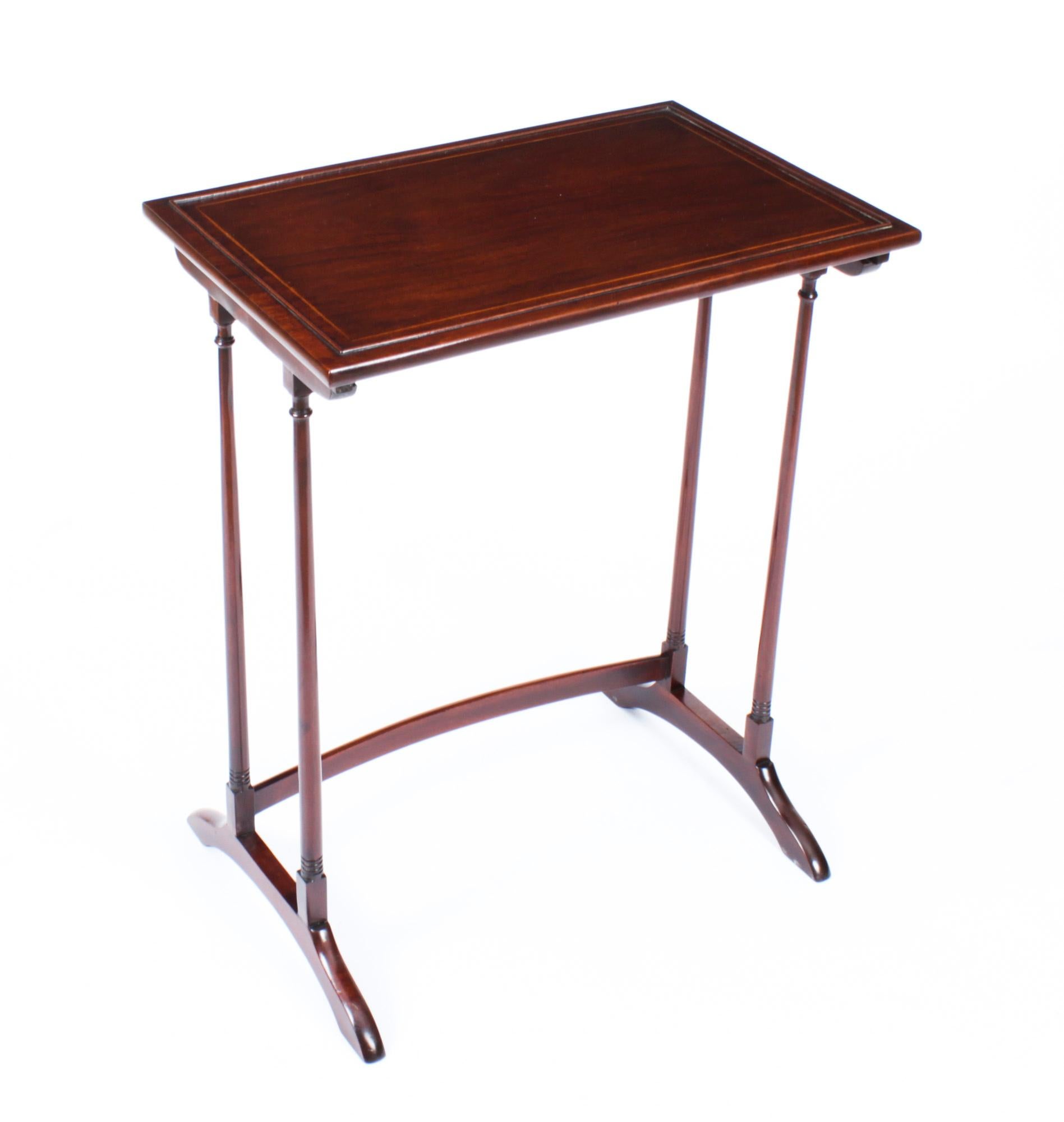 This is a beautiful antique Edwardian mahogany and satinwood banded nest of tables, circa 1900 in date. 
 
The nest consists of a set of four matching interlocking tables, the rich mahogany rectangular tops are all line inlaid in satinwood and