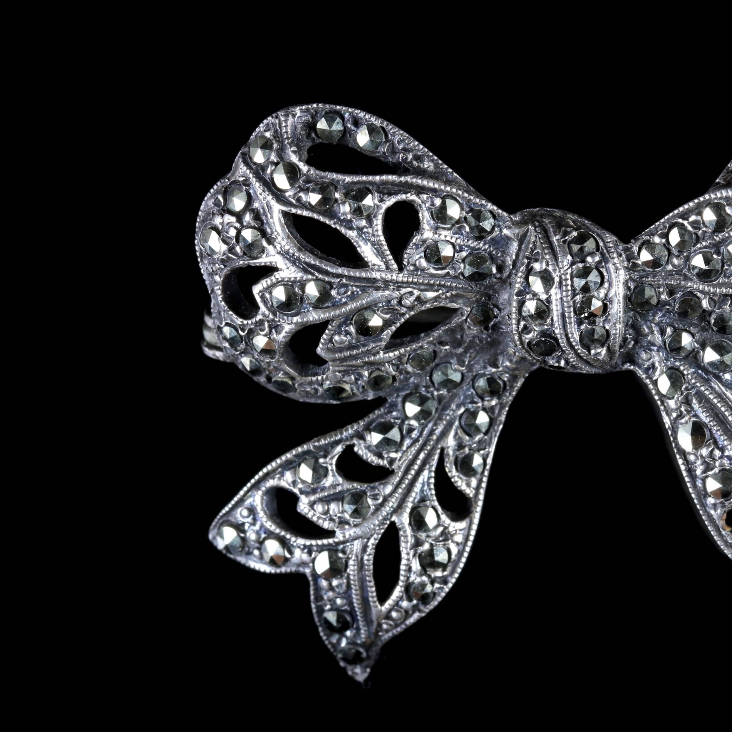 This beautiful Silver Edwardian bow brooch is adorned in Marcasites, Circa 1910.

During the Edwardian period jewellery became strikingly feminine with a lacy and delicate appearance. Bows very quickly became modern motifs.

The bow brooch shows