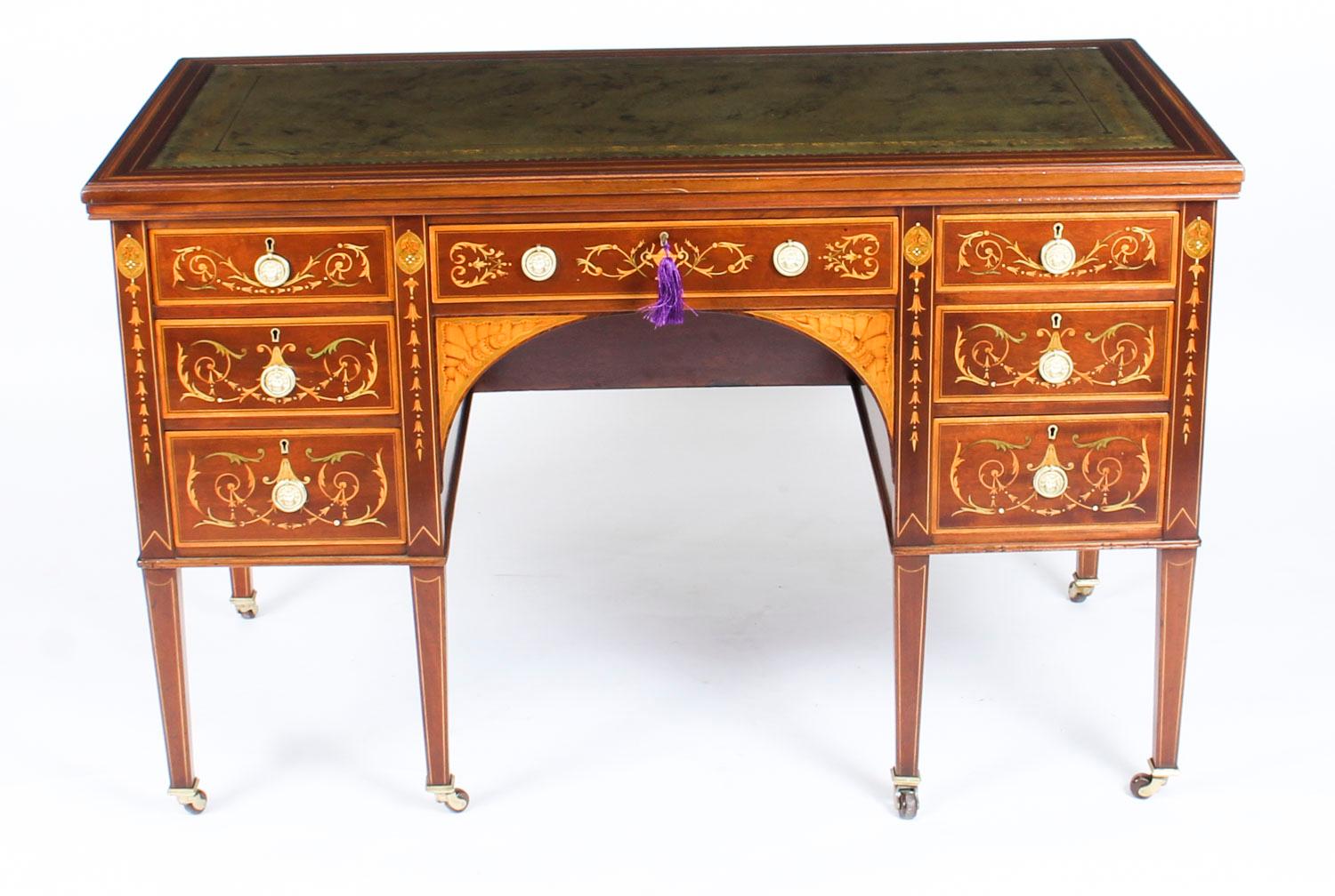 This is a stunning antique Edwardian writing desk, circa 1890 in date and in the manner of the renowned retailer and cabinet maker Edwards & Roberts.

It has a fabulous inset gold tooled green leather writing surface and is made of solid mahogany