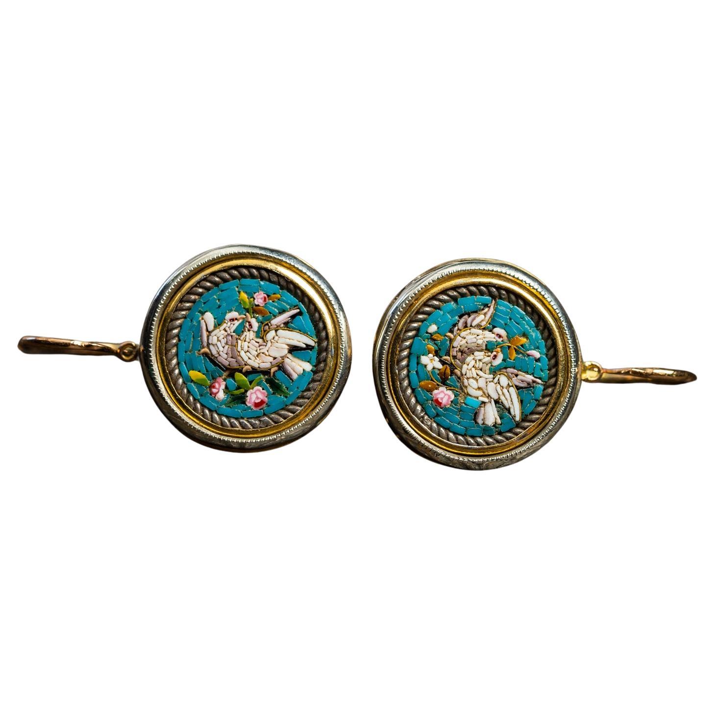 A truly remarkable and rare Italian antique micro mosaic earrings. These earrings are made of solid 12 ct gold and are decorated with a perfectly preserved micro mosaic.

The mosaic depicts two beautiful doves surrounded by florals. From the ancient