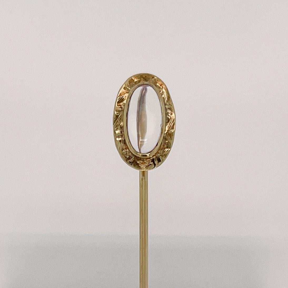 A very fine antique Edwardian gold and moonstone stickpin.

With a smooth, oval moonstone cabochon bezel set in 10k gold with decorative oval frame.

Simply a great stickpin!

Date:
Early 20th Century

Overall Condition:
It is in overall good,