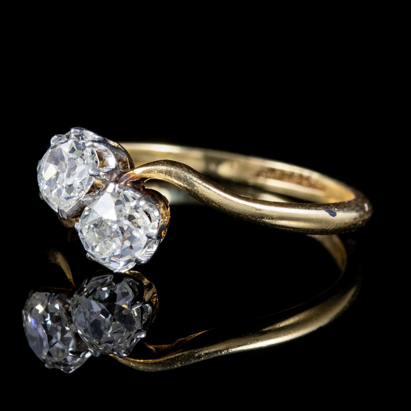 A spectacular antique Edwardian ring set with two stunning 0.40ct old European cut Diamonds which sparkle with immense life and brilliance.

The Edwardian period was also known as the ‘Beautiful era’ and engagement rings were romantic and elegant in
