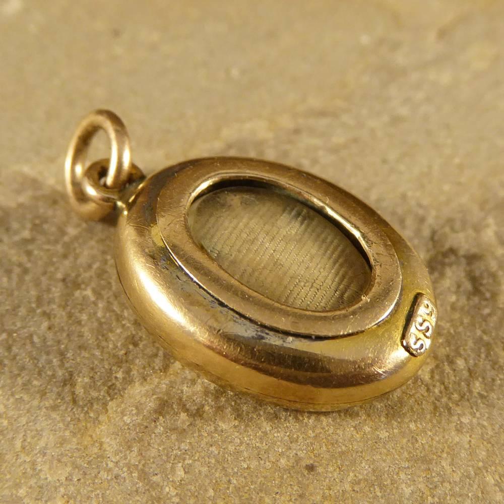 This gorgeous little pendant features an Opal stone set in the centre with a locket on the reverse side. Crafted from 9ct Yellow Gold and made in the Edwardian era, this pendant would look great on a fine gold chain (click here for link to chain)