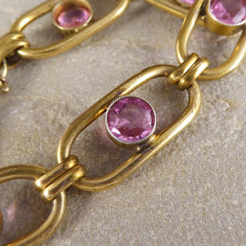This bracelet was created in the Edwardian era and has been crafted in pink paste and rolled gold. 
Funky and fabulous, it looks great on the wrist!

Condition: Very Good, slightest signs of wear due to age and use
Defects: None
Date / Period: