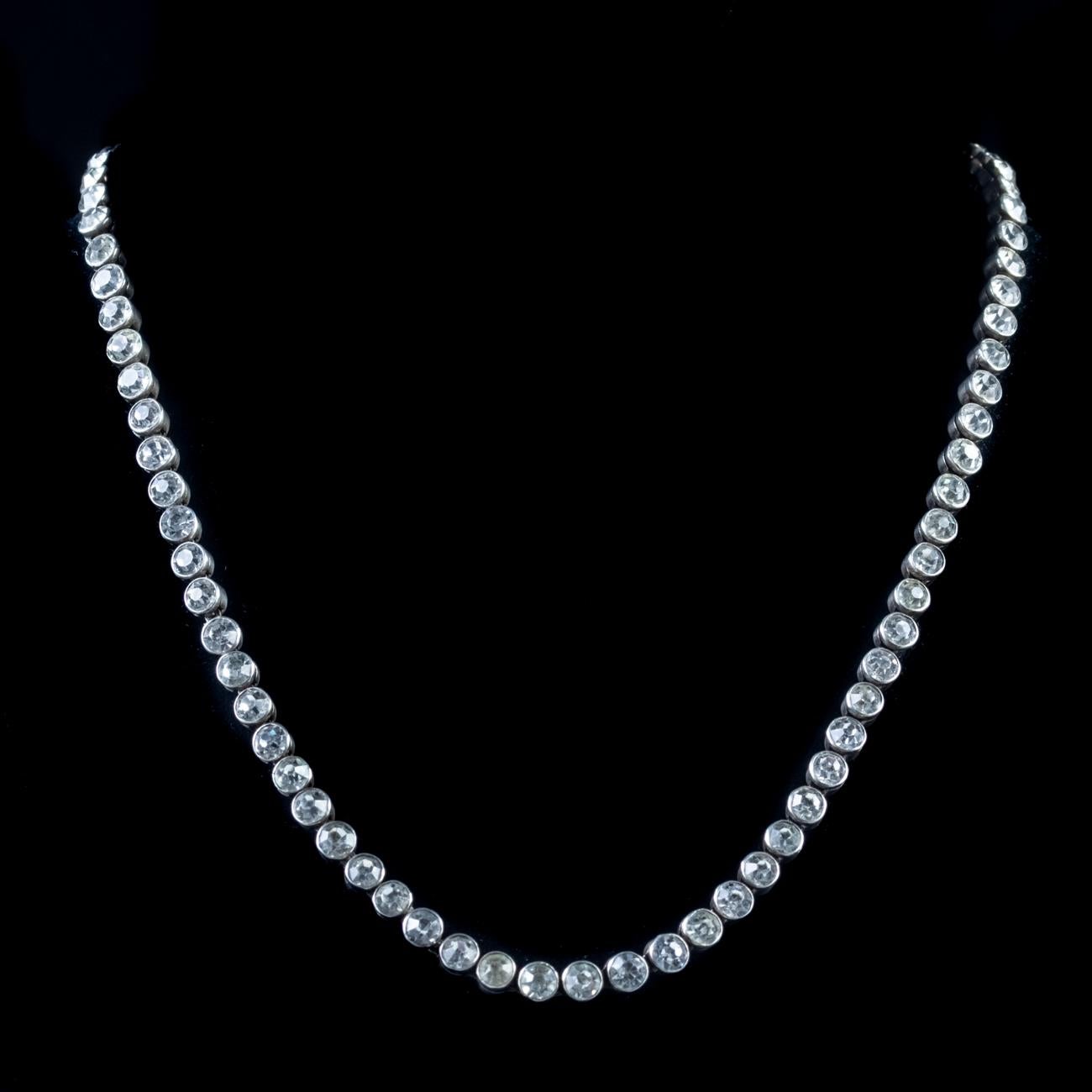 This elegant Antique Edwardian collar necklace has been modelled in Sterling Silver and each link is set with a dazzling Paste stone weighing approx. 0.15ct.

Paste is a heavy, transparent flint glass that simulates the fire and brilliance of