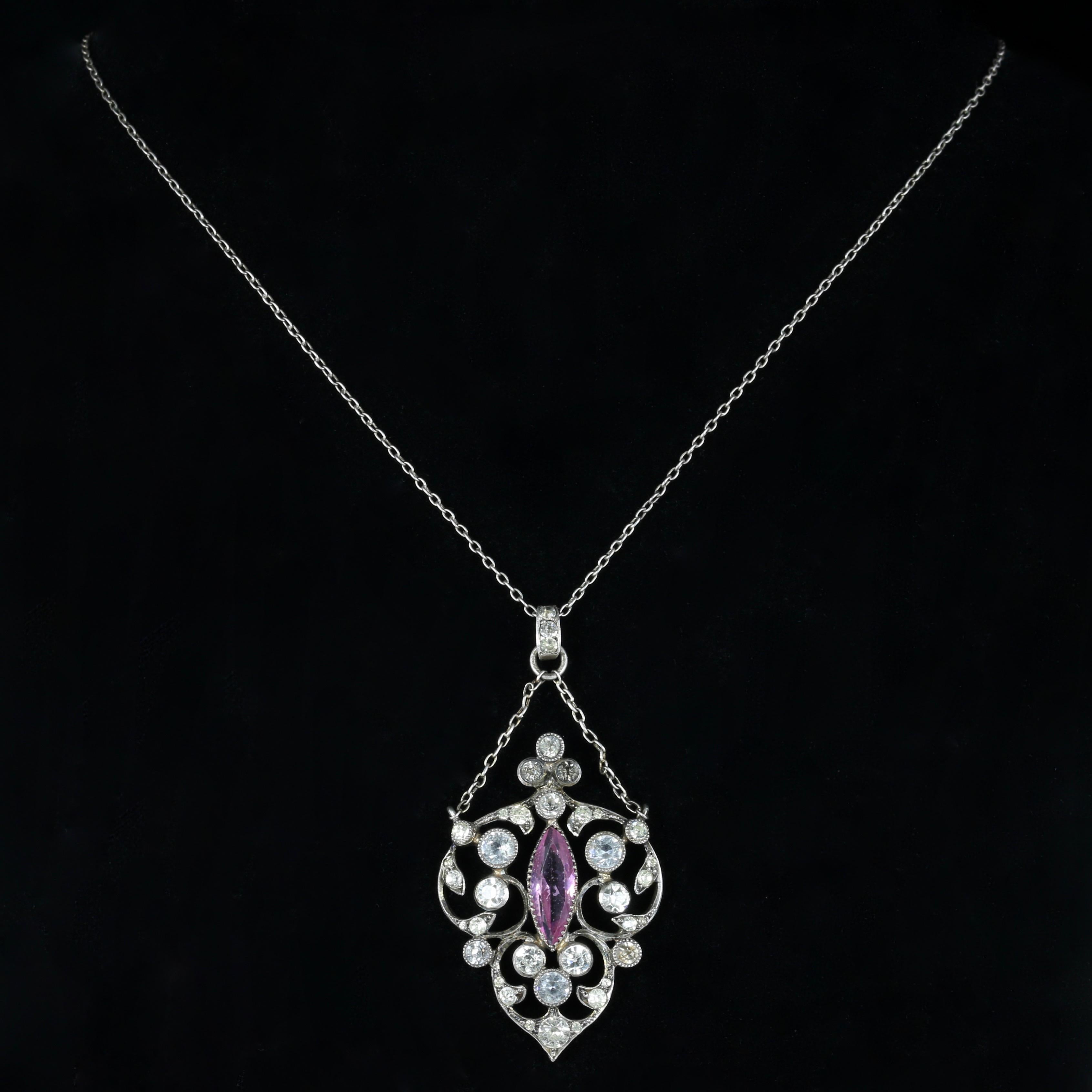 For more details please click continue reading down below...

This fabulous antique genuine Edwardian pendant necklace is set with lovely Paste stones. Circa 1915

Set with a lovely marquise cut pink Paste stone in the centre and old cut Paste