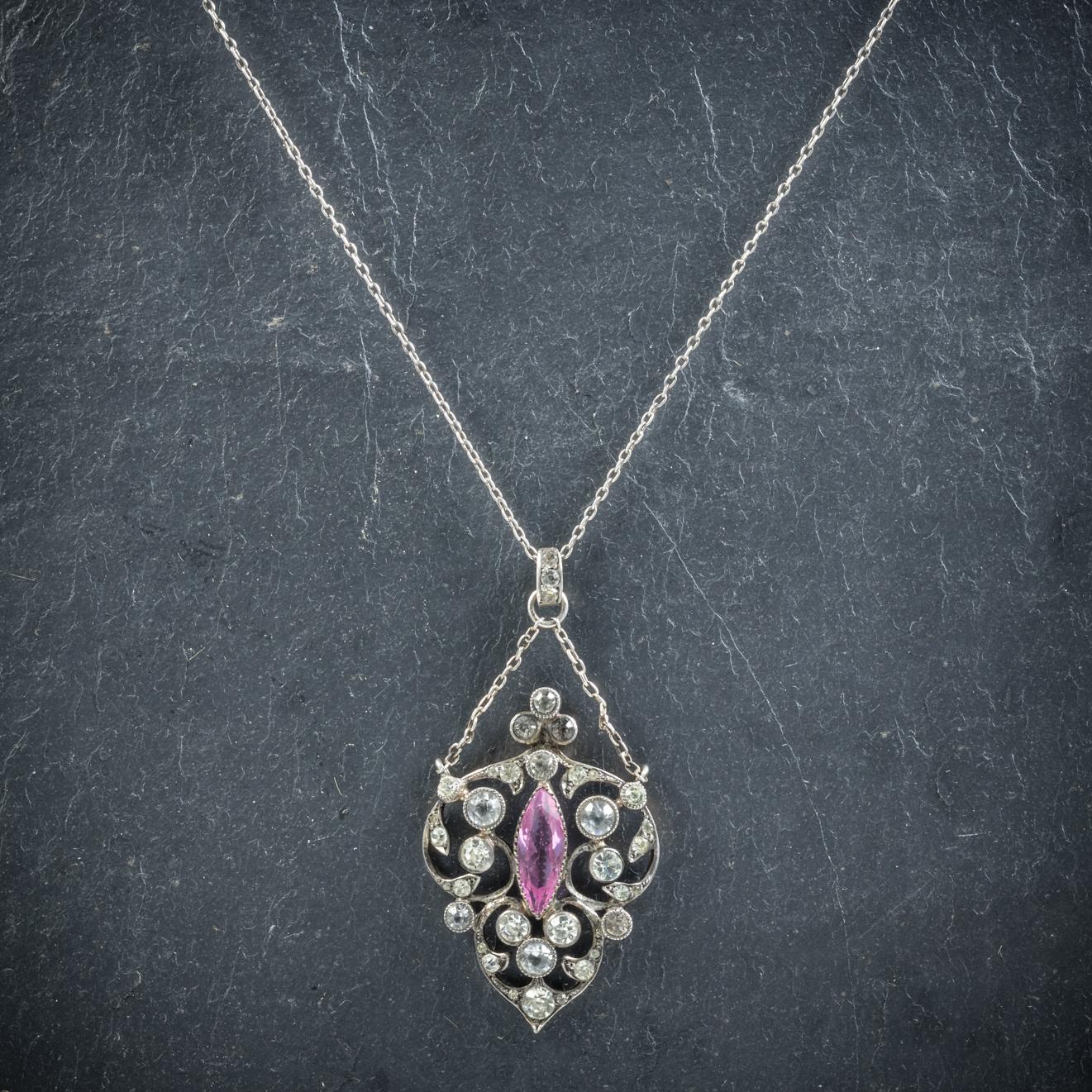 This fabulous antique Paste pendant and chain is Edwardian, Circa 1915

Set with a lovely marquise cut pink Paste stone in the centre and white Paste stones chasing around the gallery

The Silver chain leads to a lower festoon that connects to the