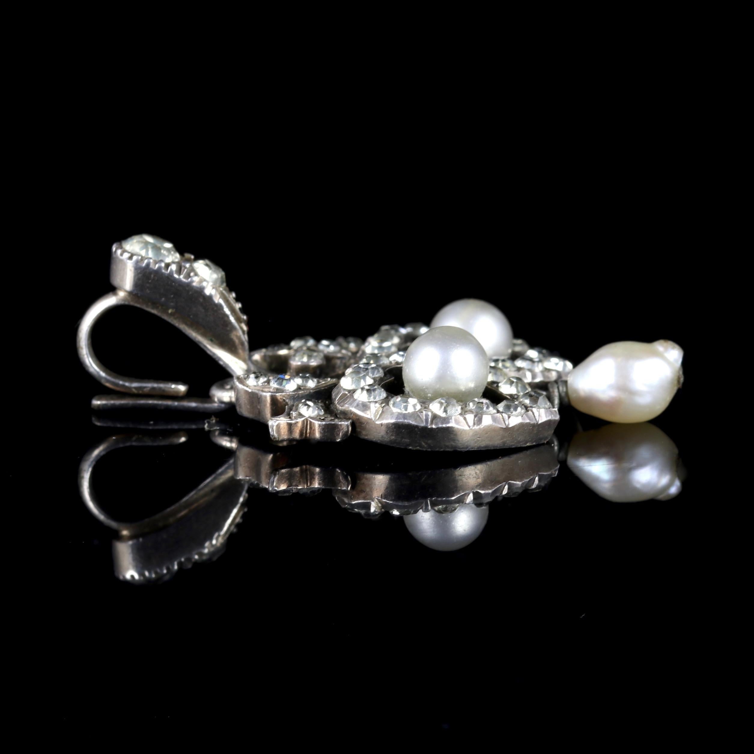 This beautiful Edwardian Paste Stone and Pearl double heart pendant is, Circa 1910.

This lovely pendant is adorned in sparkling Paste Stones in a double heart gallery, with two Cultured Pearl in-between leading to another Pearl dropper.

Paste is a