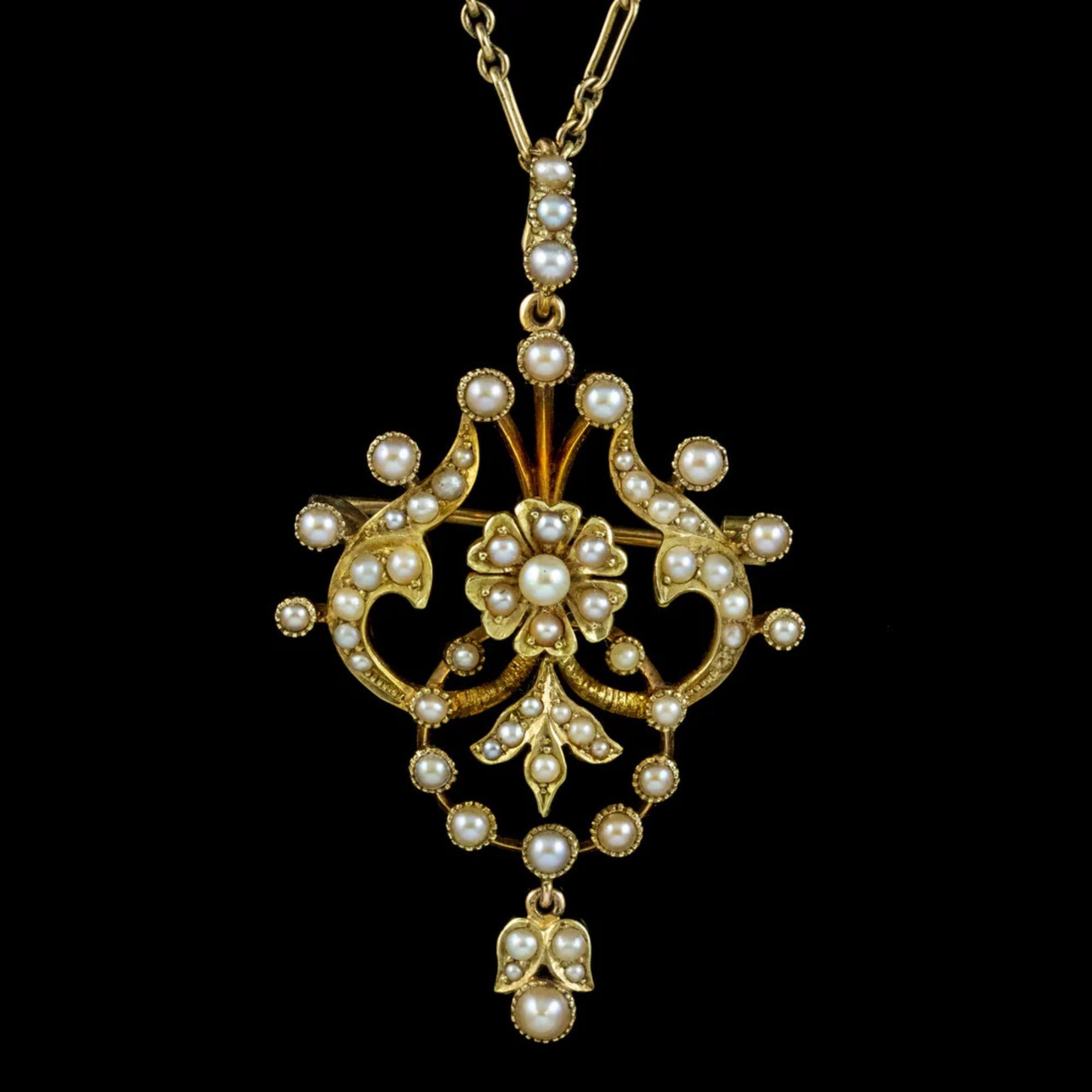 A fabulous antique Art Nouveau pendant from the early 20th Century crafted in 15ct gold. It has a wonderful open-work design, with flowing foliate motifs and a central flower all decorated with gleaming white pearls. 

Pearls are the birthstone of