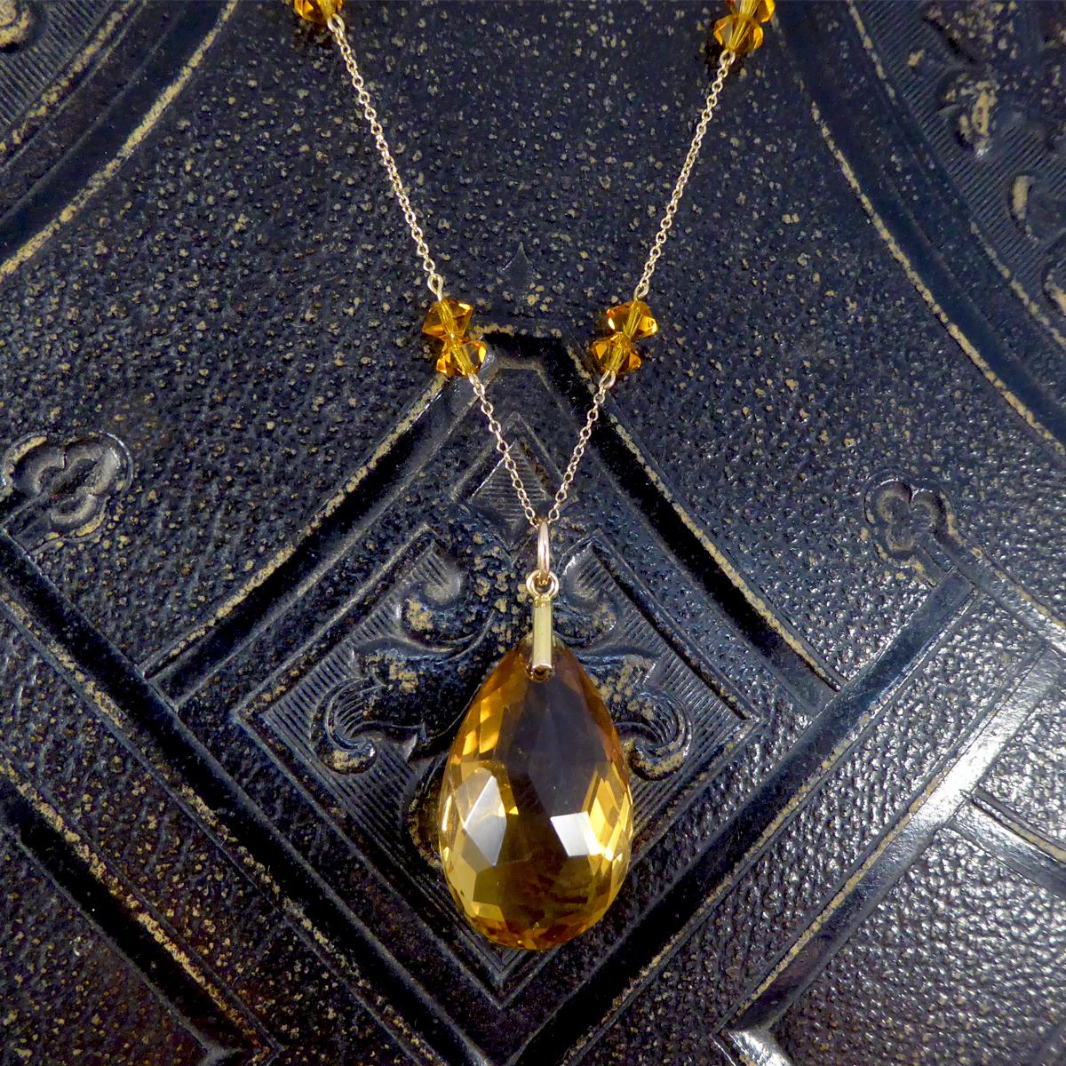 Such a gorgeous and graceful antique necklace. It has been hand crafted in the Edwardian era, featuring a Critrene drop pendant with Citrene spacers throughout the 9ct Yellow Gold Chain.

Condition: Very Good, slightest signs of wear due to age and