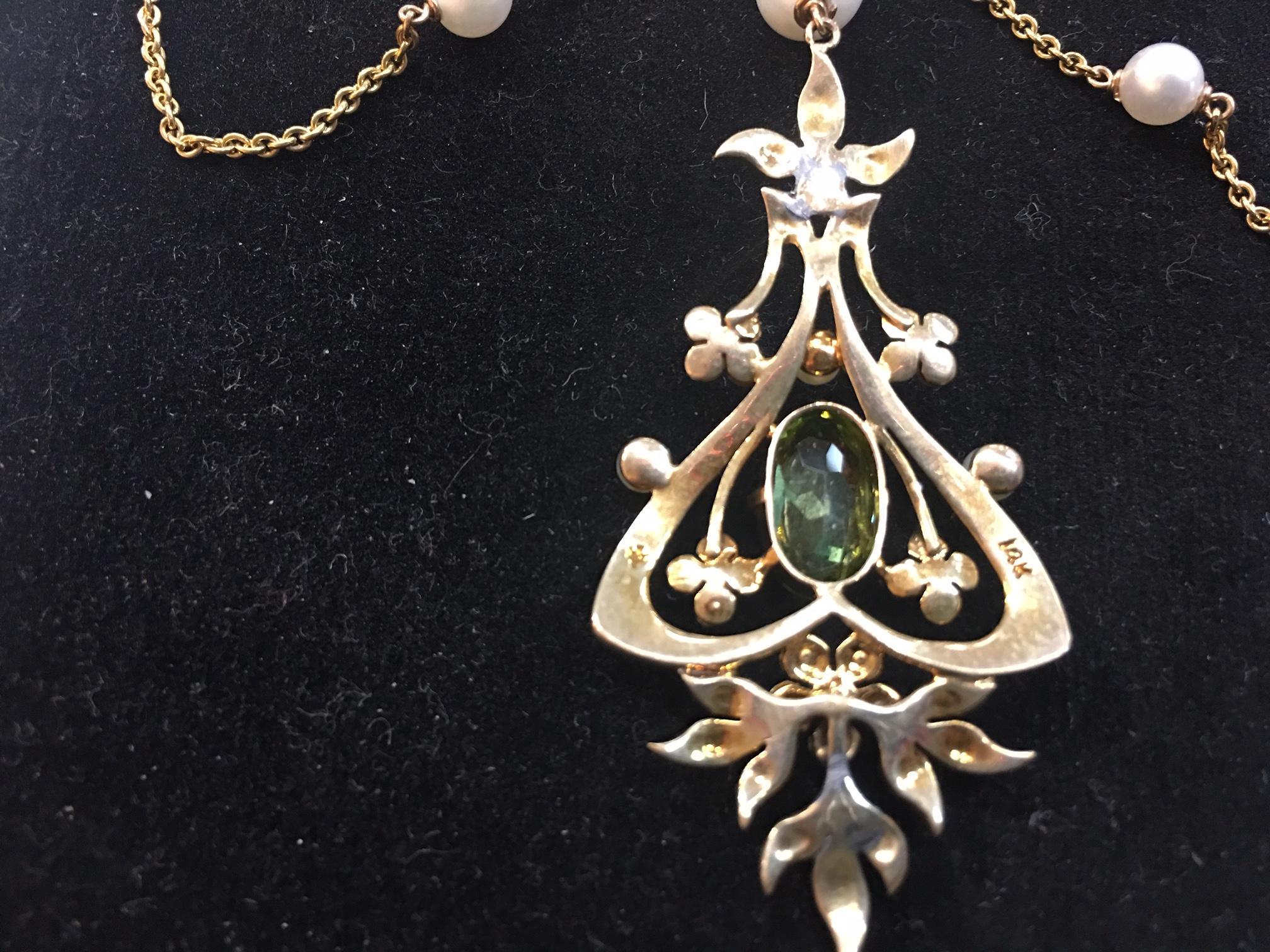 Exquisite Edwardian Swag Necklace, beautifully worked Peridot and pearl medallions, linking gold chain inter-spaced with pearls. Approx. 17.25 inches long with drop measuring an additional 3 inches. Complimentary adjustment of chain length 