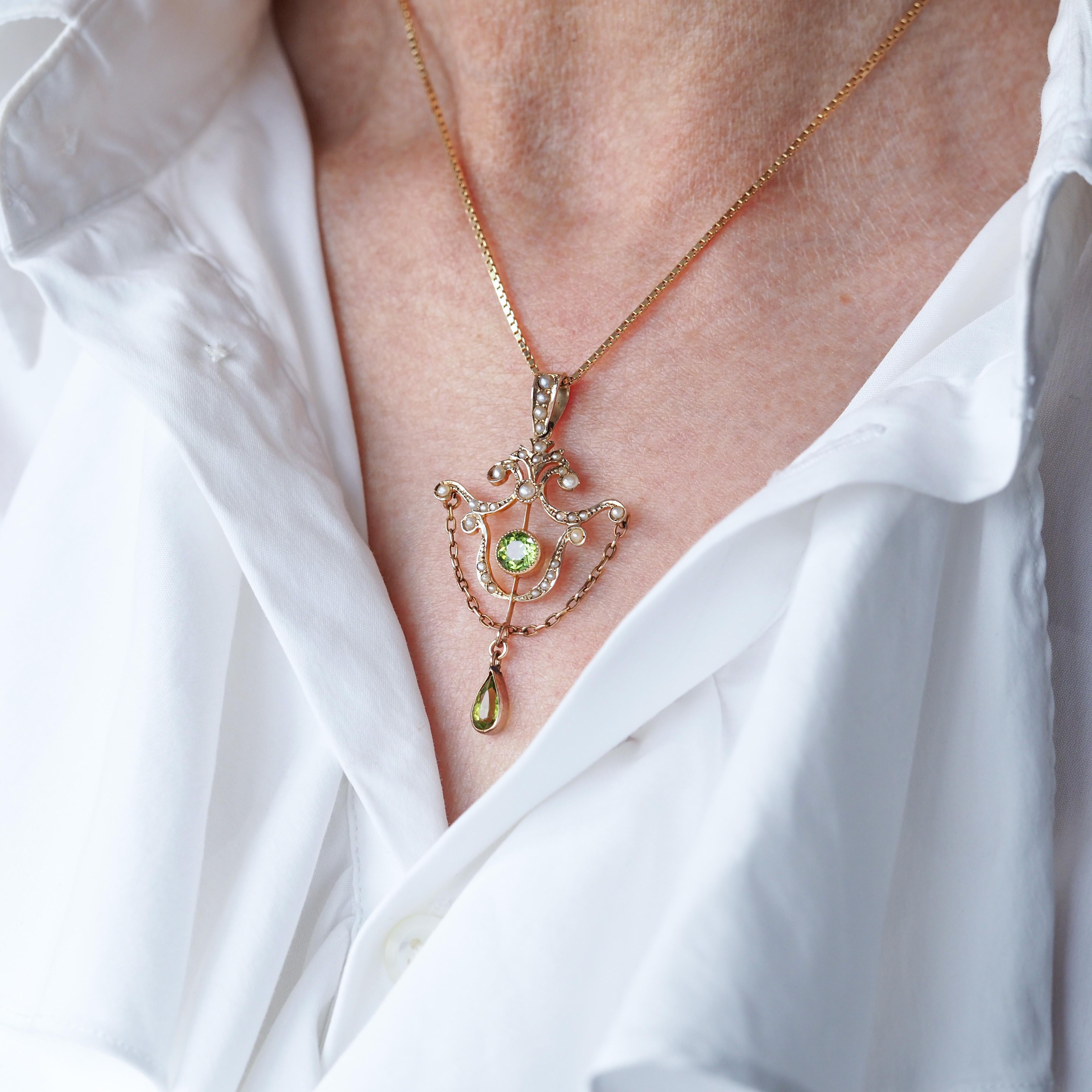 We are delighted to offer this splendid Edwardian antique 9ct gold peridot and pearl necklace made in Birmingham 1909.

Distinguished in style and unapologetically Edwardian, this pendant features the most wonderful of Edwardian and scrolled
