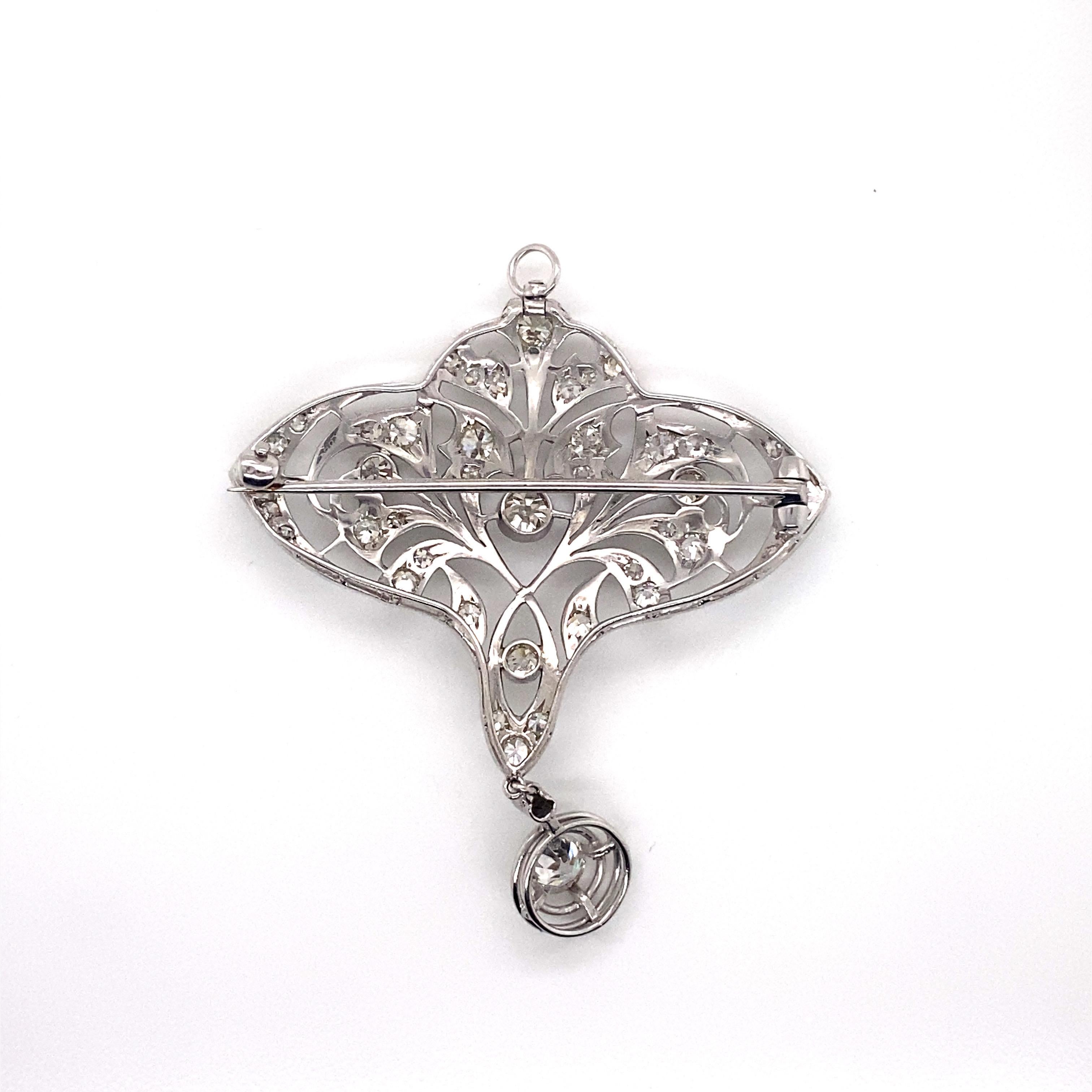 Antique Edwardian Period Platinum Filigree and Milgrain Diamond Brooch Pendant - The brooch is set with 42 Old European Cut diamonds with an approximate 1.90ct total weight. The diamond quality ranges from H - K color and VS1 - I1 clarity. The