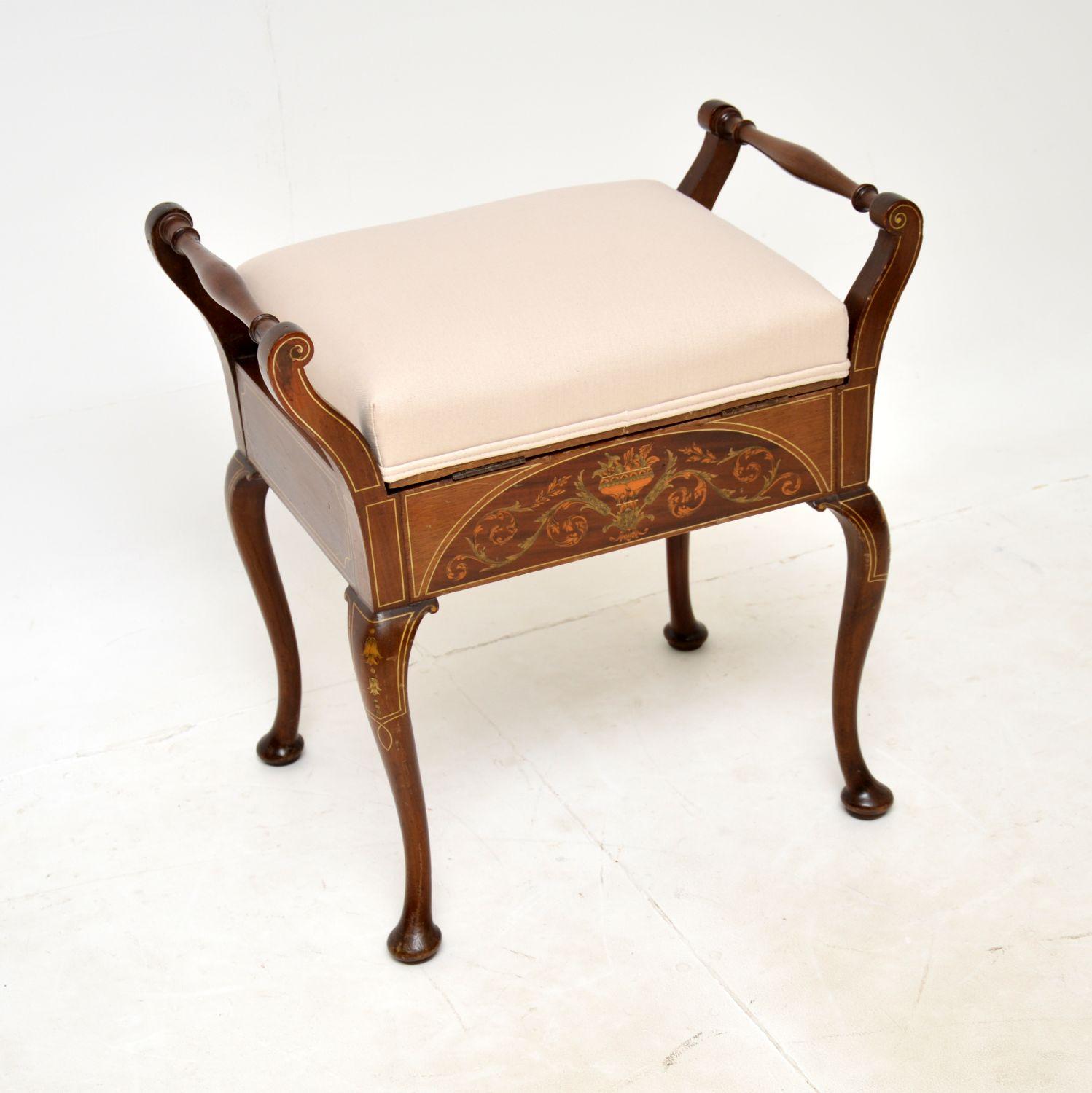A beautiful original antique Edwardian piano stool. This was made in England, it dates from around the 1890-1900 period.

It is of superb quality, with beautiful inlays on both sides. This sits on cabriole legs, the seat lifts up to reveal storage