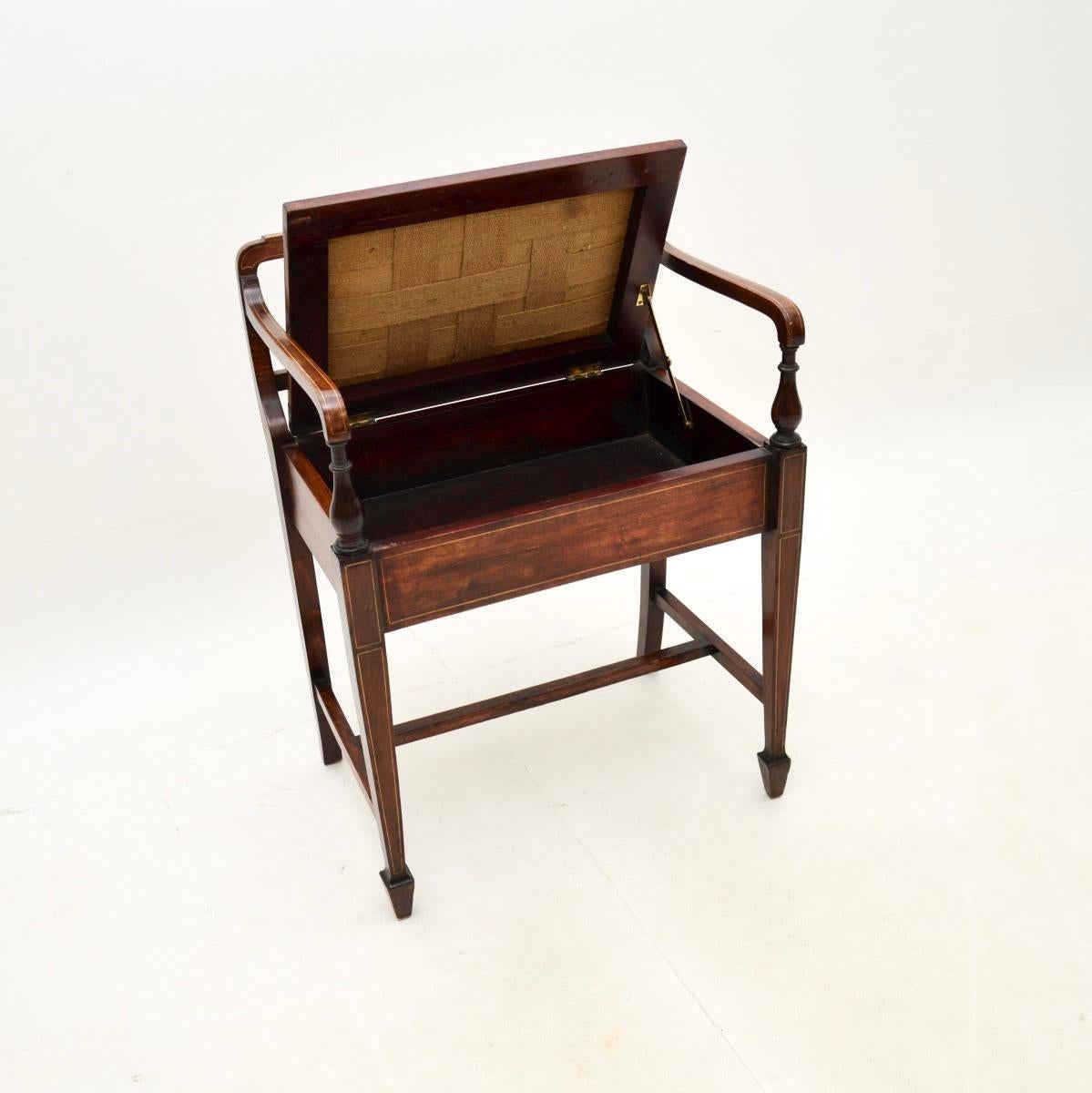 A smart and beautifully designed antique Edwardian piano stool. This was made in England, it dates from around 1900-1910.

It is of fine quality and is a lovely size, the upholstered seat lifts up to reveal storage space inside. It stands on tapered