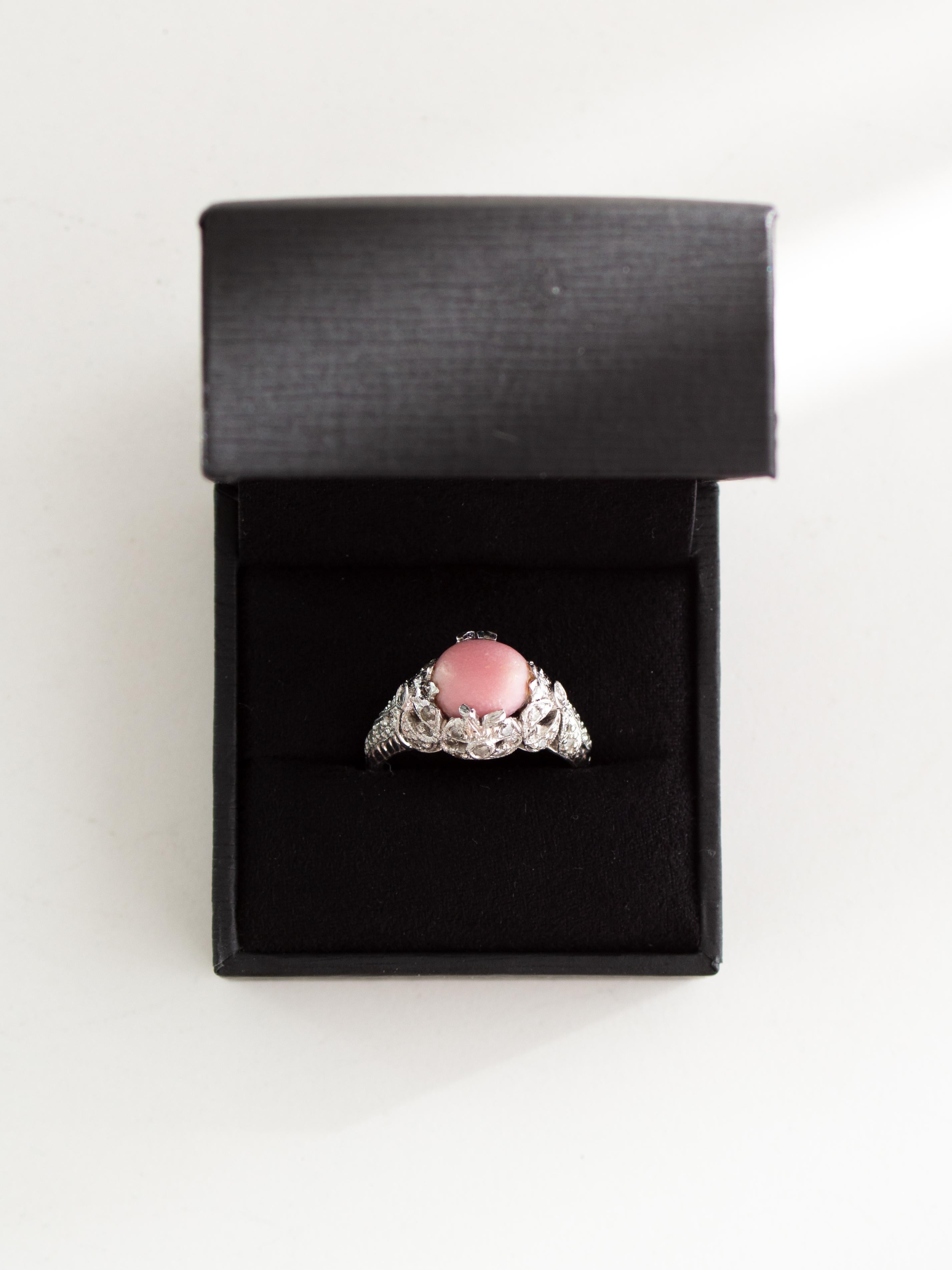 This exquisite vintage ring, believed to be from the Edwardian era (circa 1910-1930), showcases a unique bow motif crafted in Platinum PT900 and adorned with 38 single-cut diamonds, with a total carat weight of 0.34. The diamonds are near colorless