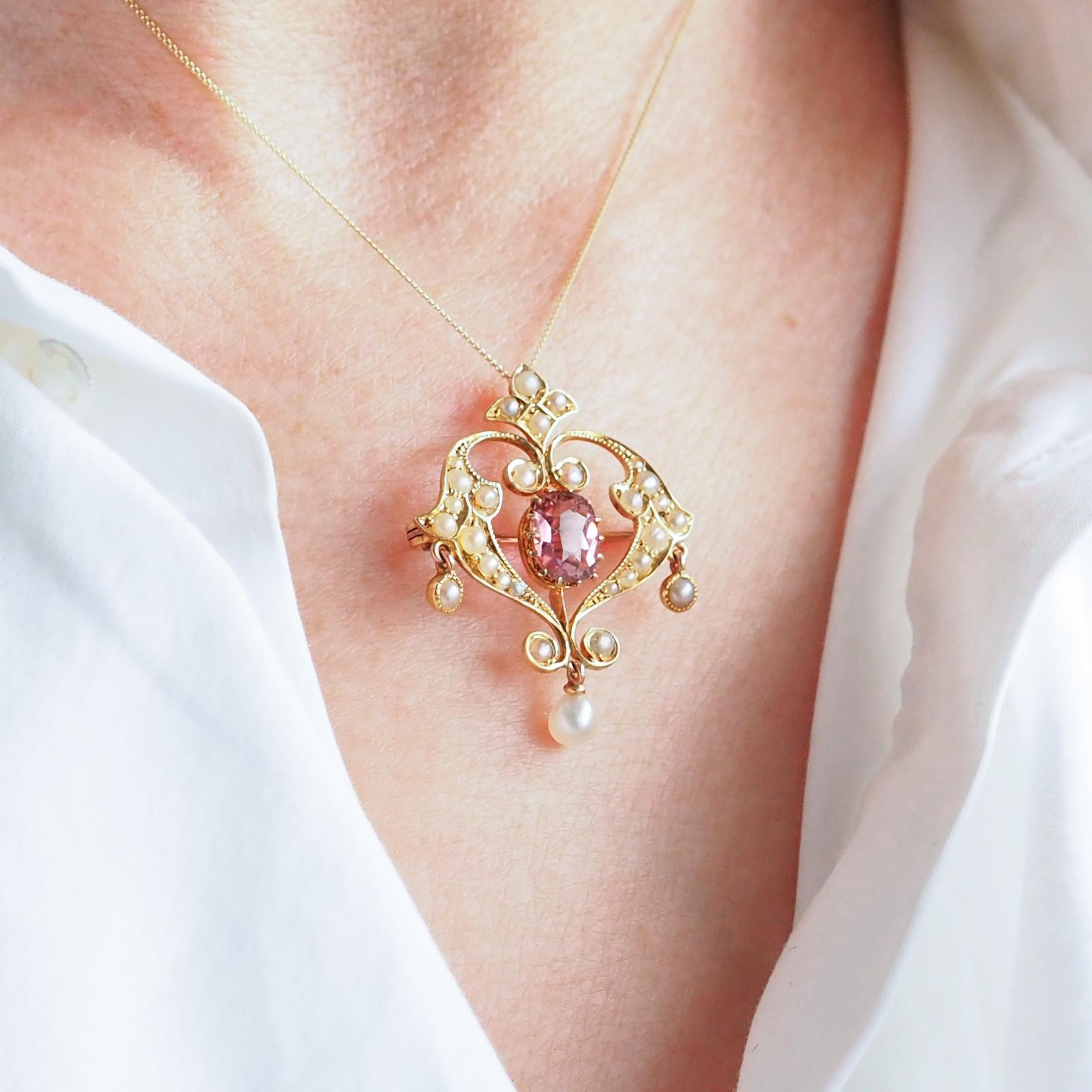 We are delighted to offer this stunning antique Edwardian pink tourmaline and seed pearl pendant necklace set in 15ct made c.1910.
 
The goldwork is beautifully crafted with a naturalistic art nouveau design of scrolled foliate motifs.
 
The pendant