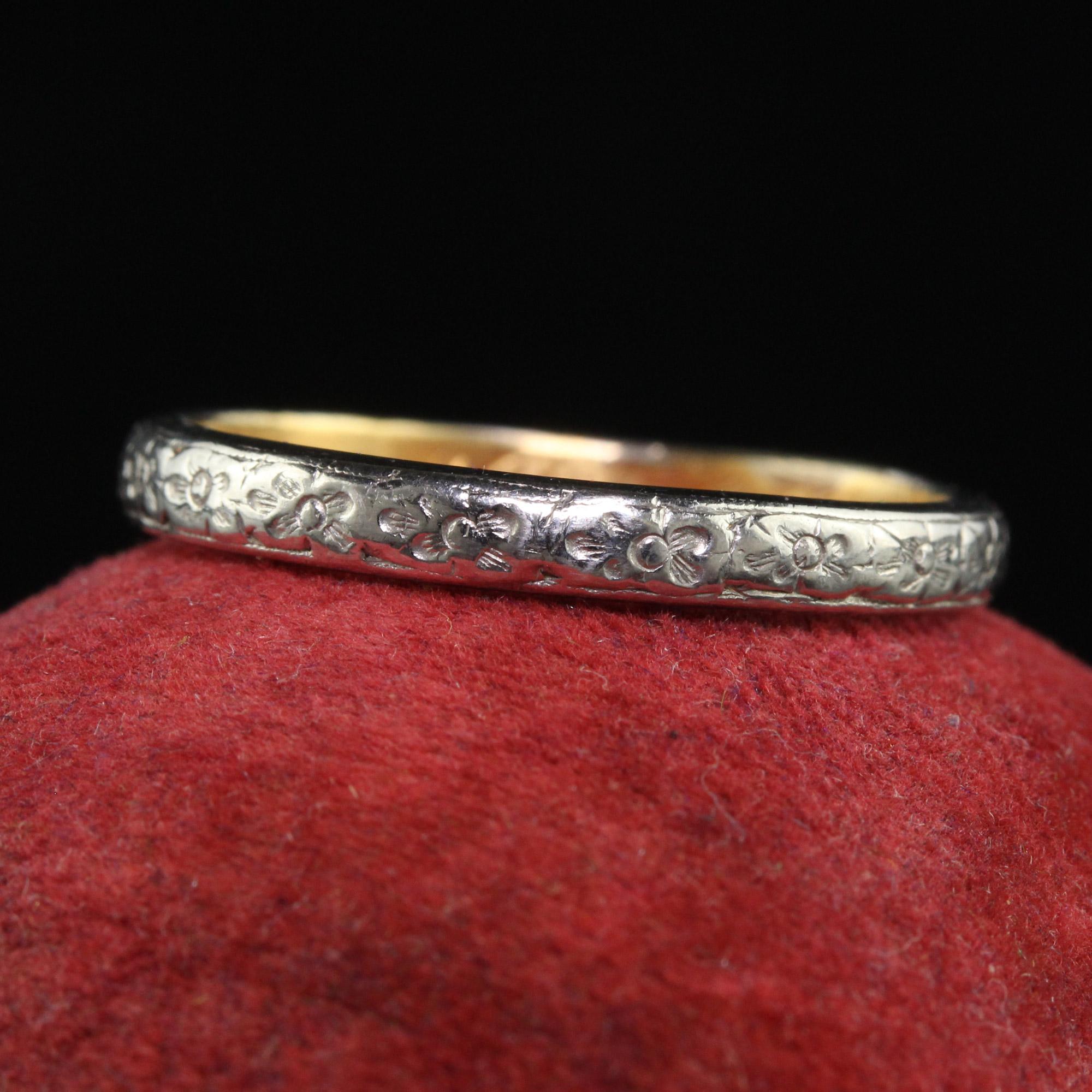 Beautiful Antique Edwardian Platinum 18K Gold Tiffany and Co Engraved Wedding Band. This This gorgeous wedding band is crafted in platinum and 18k yellow gold. The top of the ring i s beautifully engraved with blossom patterns and the inside of the