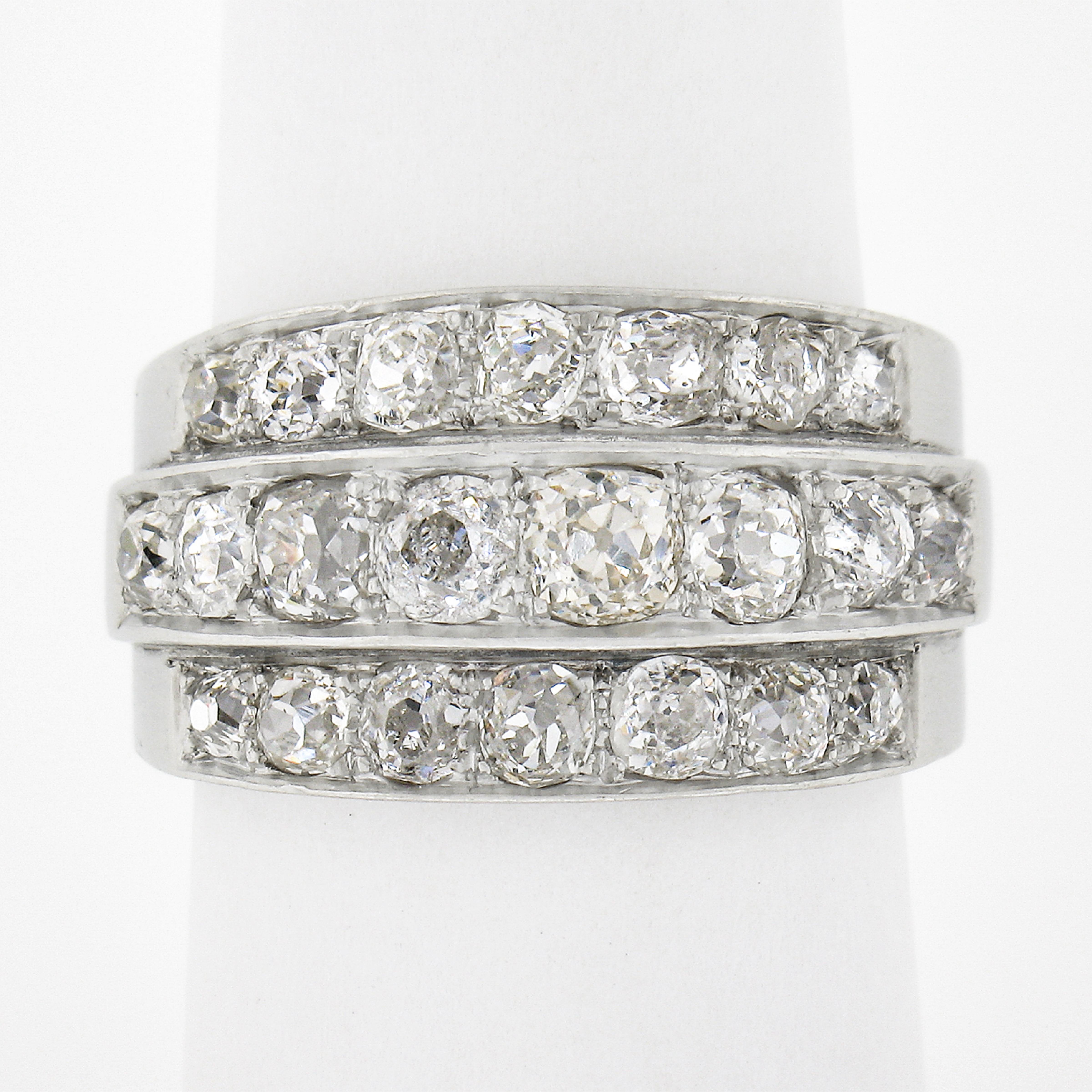 This desirable wide antique Edwardian band/ring features 3 rows of heart warming chunky old mine cut diamonds. Each diamond takes on its own life as they each sparkle uniquely with their own special facet pattern. The ring is all original and