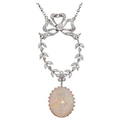 Antique Edwardian Platinum and Gold Bow Motif Diamond and Opal Drop Pendant
