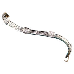 Bracelet ancien édouardien en platine et or jaune gravé de diamants taille vieille Europe