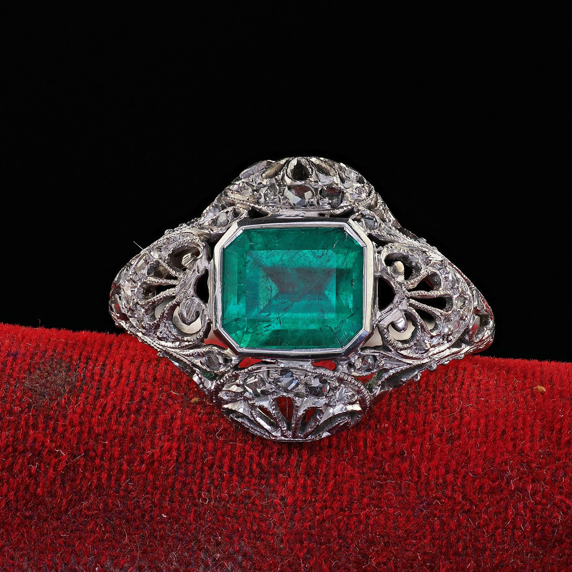 Beautiful Antique Edwardian Platinum Colombian Emerald Diamond Filigree Engagement Ring. This gorgeous Edwardian Colombian emerald diamond engagement ring is crafted in platinum. This beautiful ring features a green Colombian emerald in the center