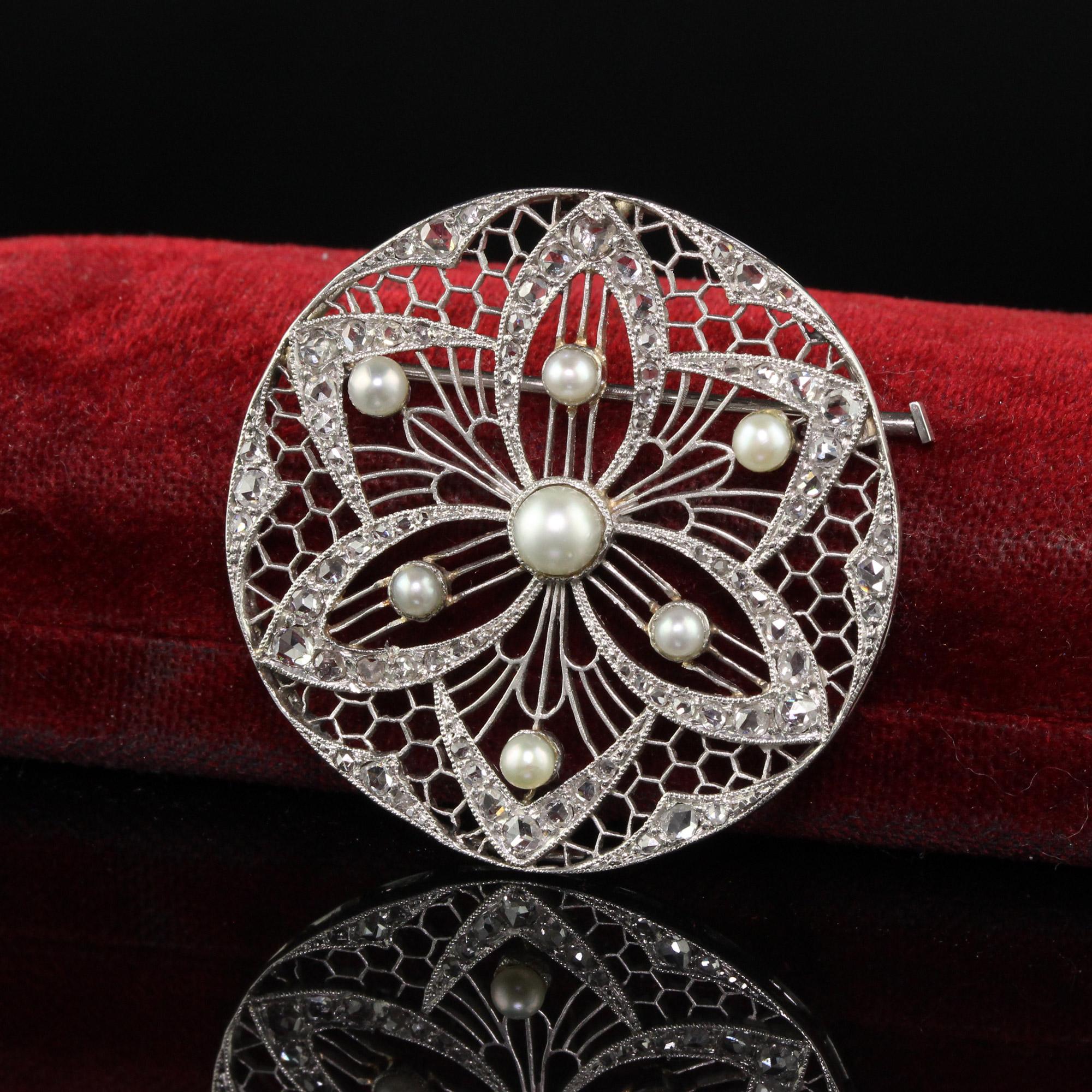 Beautiful Antique Edwardian Platinum Diamond and Pearl Filigree Pin. This incredible pin is crafted in platinum. The pin has beautiful rose cut diamonds set in an intricate filigree mounting with pearls. The pin is in good condition but shows signs