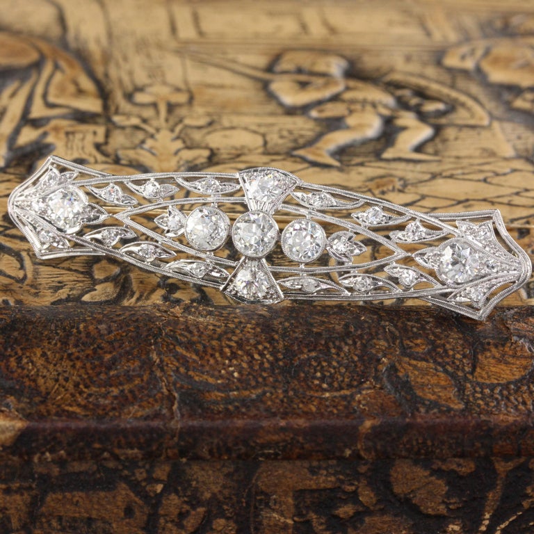 A stunning platinum and diamond bar brooch from the Edwardian era with beautiful and delicate milgraining.

Metal: Platinum

Weight: 12 Grams

Diamond Weight: Approximately 3.50 cts

Diamond Color: H

Diamond Clarity: VS2

Measurements: 17 x 66 mm
