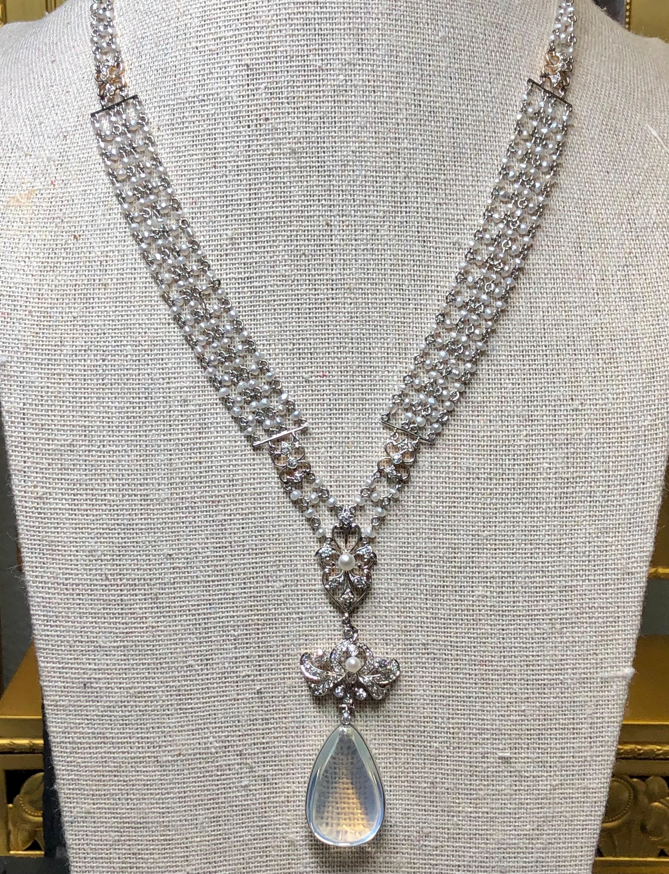 This exquisite and delicate piece is perfect down to the last detail. Dating back to 1910-1920, this rare find has been kept in near perfect t condition. It is hand crafted in platinum and set with natural seed pearls covering every portion. In the