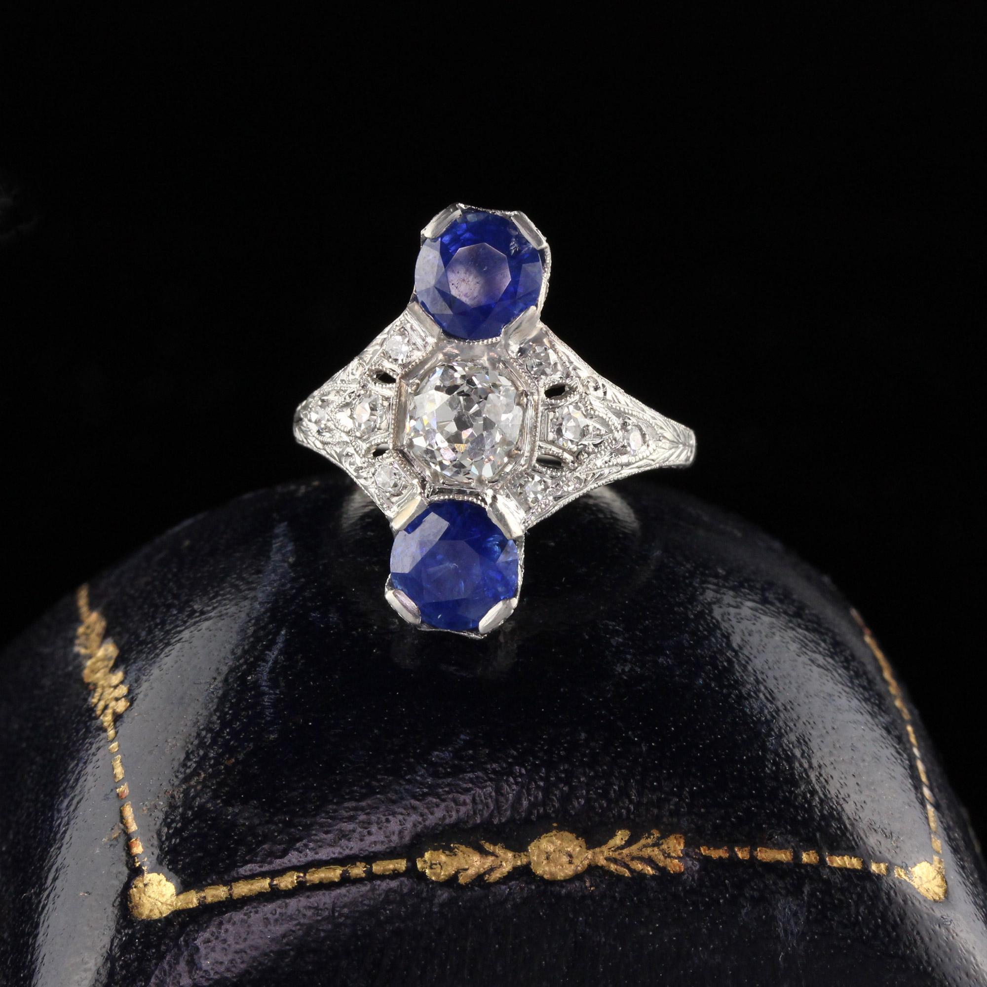 Gorgeous Edwardian shield ring with 2 sapphires and a 0.80 CT Old European cut diamond in the center.

#R0410

Metal: Platinum

Weight: 5.1 Grams

Center Diamond Weight: Approximately 0.80 CTS 

Center Diamond Color: H

Center Diamond Clarity: