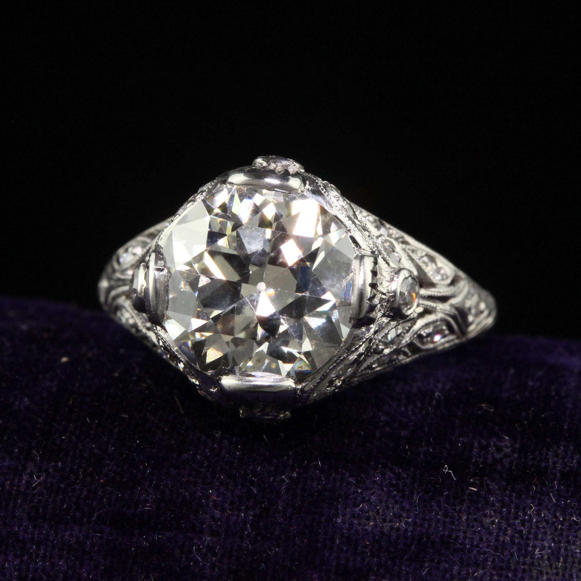 Beautiful Antique Edwardian Platinum Old Cut Diamond Floral Engagement Ring - GIA. This gorgeous Edwardian engagement ring is crafted in platinum. This ring features a gorgeous old transitional cut diamond in the center of an incredible floral