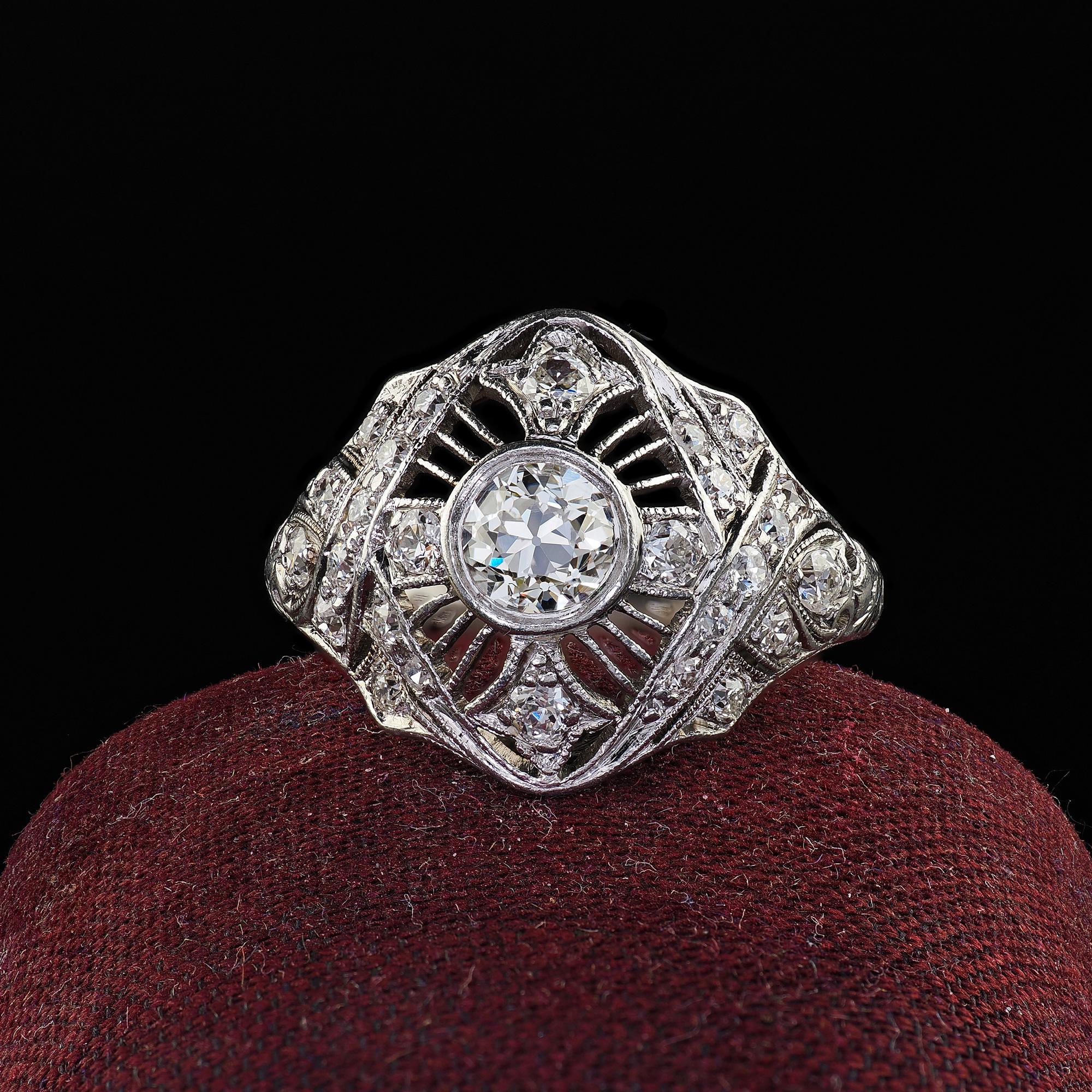 Beautiful Antique Edwardian Platinum Old Euro Diamond Filigree Engagement Ring. This gorgeous Antique Edwardian old Euro diamond engagement ring is crafted in platinum. The ring features a beautiful old European cut diamond in the center and is