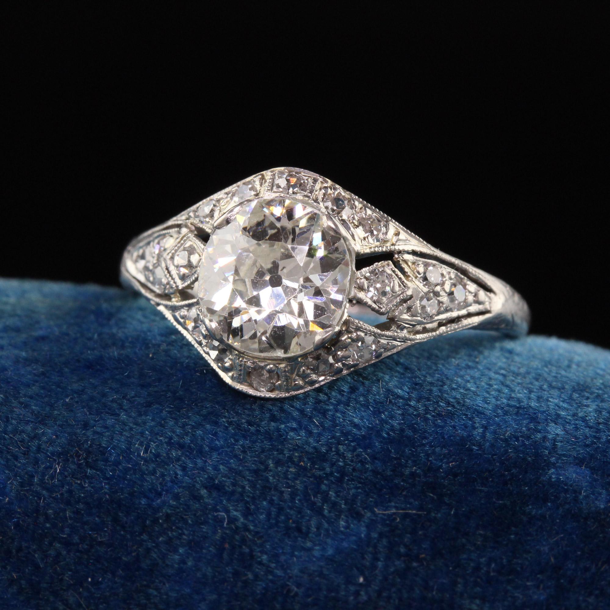 Beautiful Antique Edwardian Platinum Old European Diamond Filigree Engagement Ring. This beautiful ring is crafted in platinum. The center holds a beautiful old european cut diamond in a pretty art deco filigree mounting. The ring is low on the