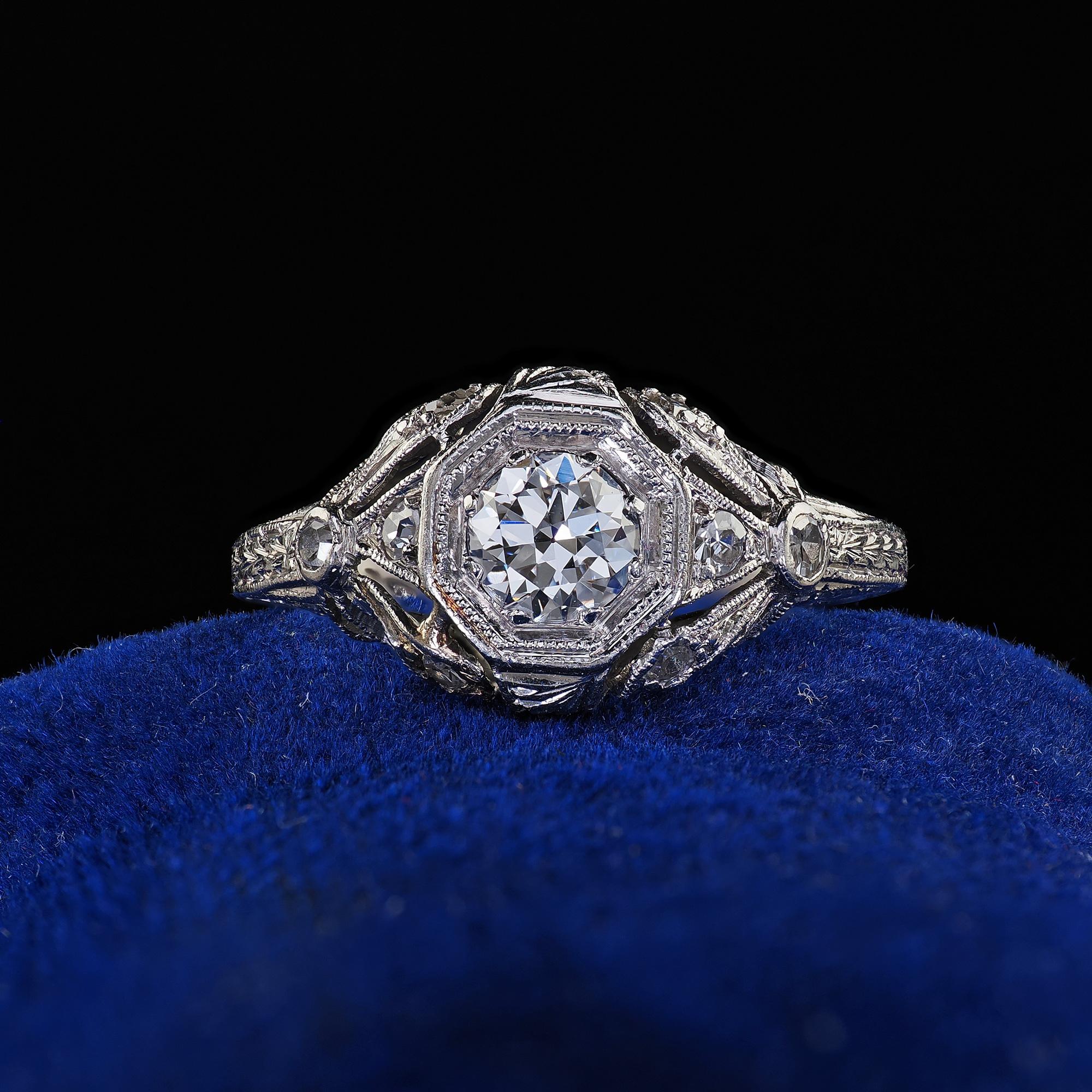 Beautiful Antique Edwardian Platinum Old European Cut Diamond Filigree Engagement Ring. This incredible Antique Edwardian old European cut diamond engagement ring is crafted in platinum. The ring features an old cut diamond in the center set in a