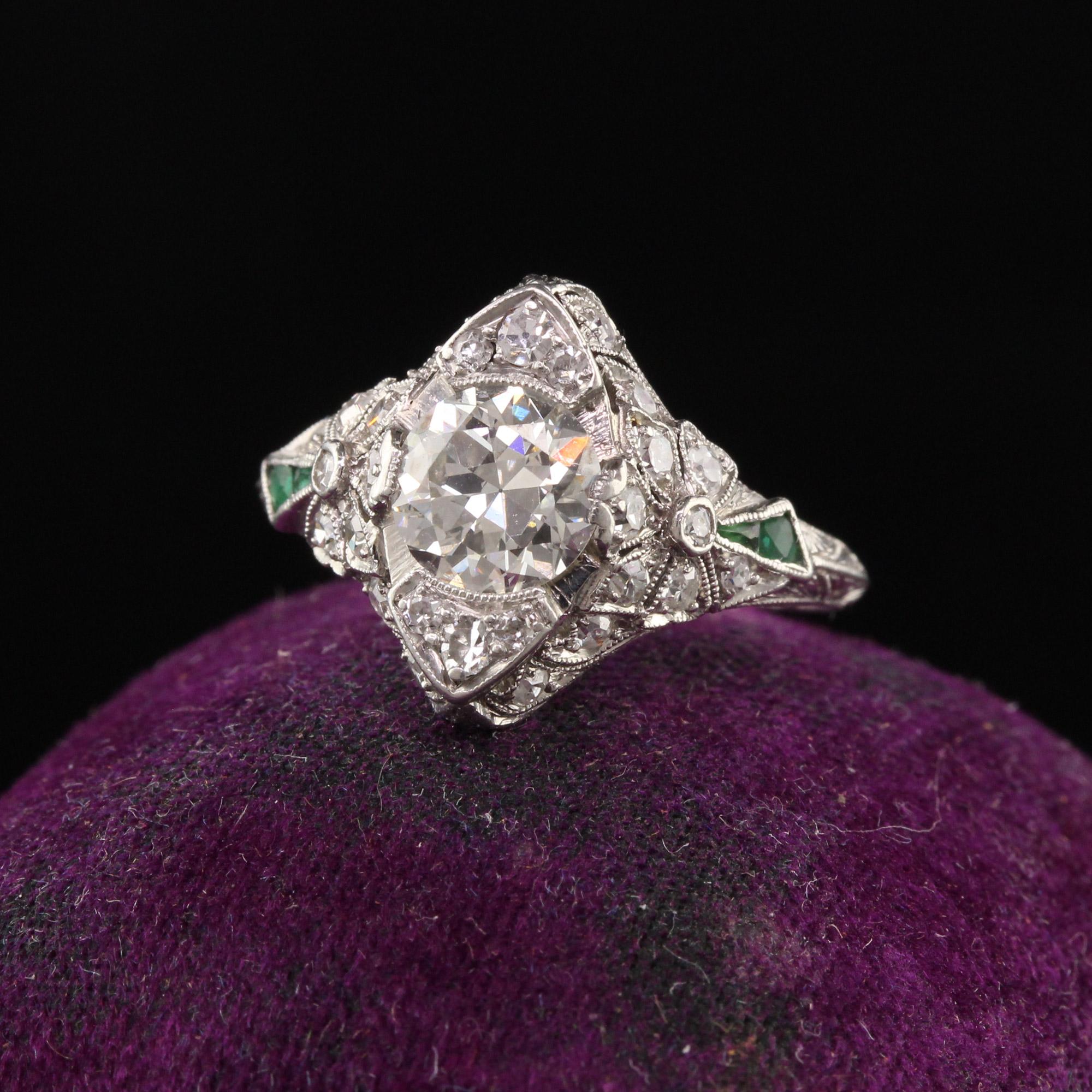 Beautiful Antique Edwardian Platinum Old European Cut Diamond Flower Motif Engagement Ring. This gorgeous ring is crafted in platinum. The center holds an old european cut diamonds that is white and clean. The mounting is in amazing condition with