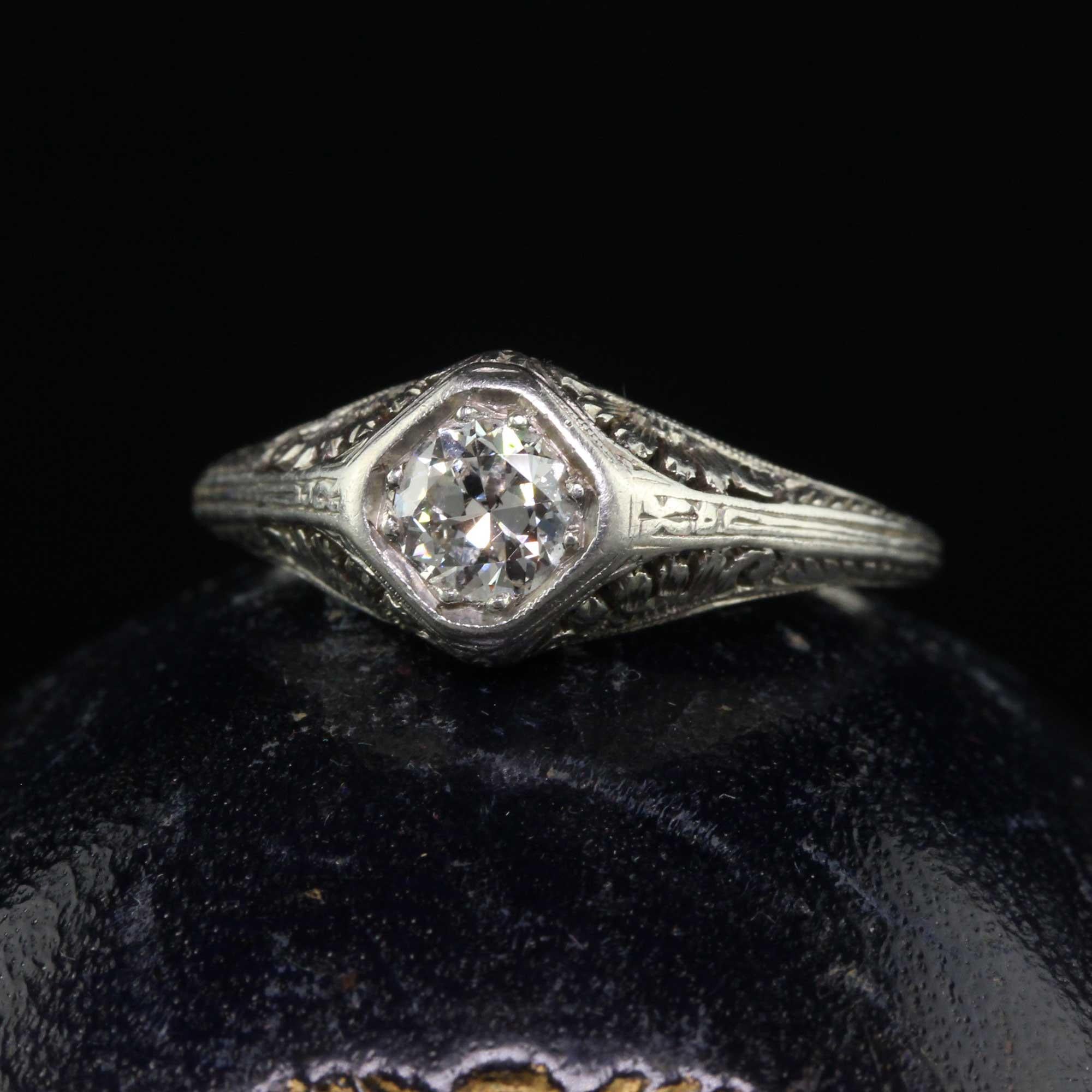Beautiful Antique Edwardian Platinum Old European Diamond Filigree Engagement Ring. This incredible engagement ring is crafted in platinum. This beautiful ring has an old European cut diamond in the center of an incredible Art Deco mounting with a
