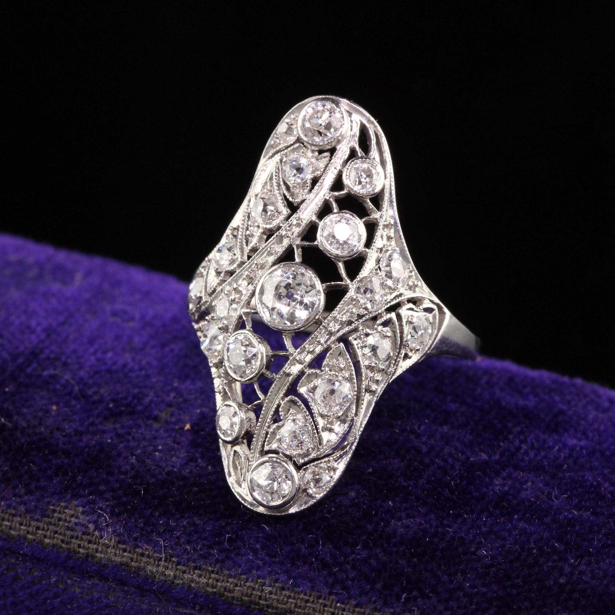Beautiful Antique Edwardian Platinum Old European Diamond Filigree Shield Ring. This incredible art deco shield ring is crafted in platinum and has old european cut diamonds set in a gorgeous art deco filigree mounting.

Item #R1222

Metal: