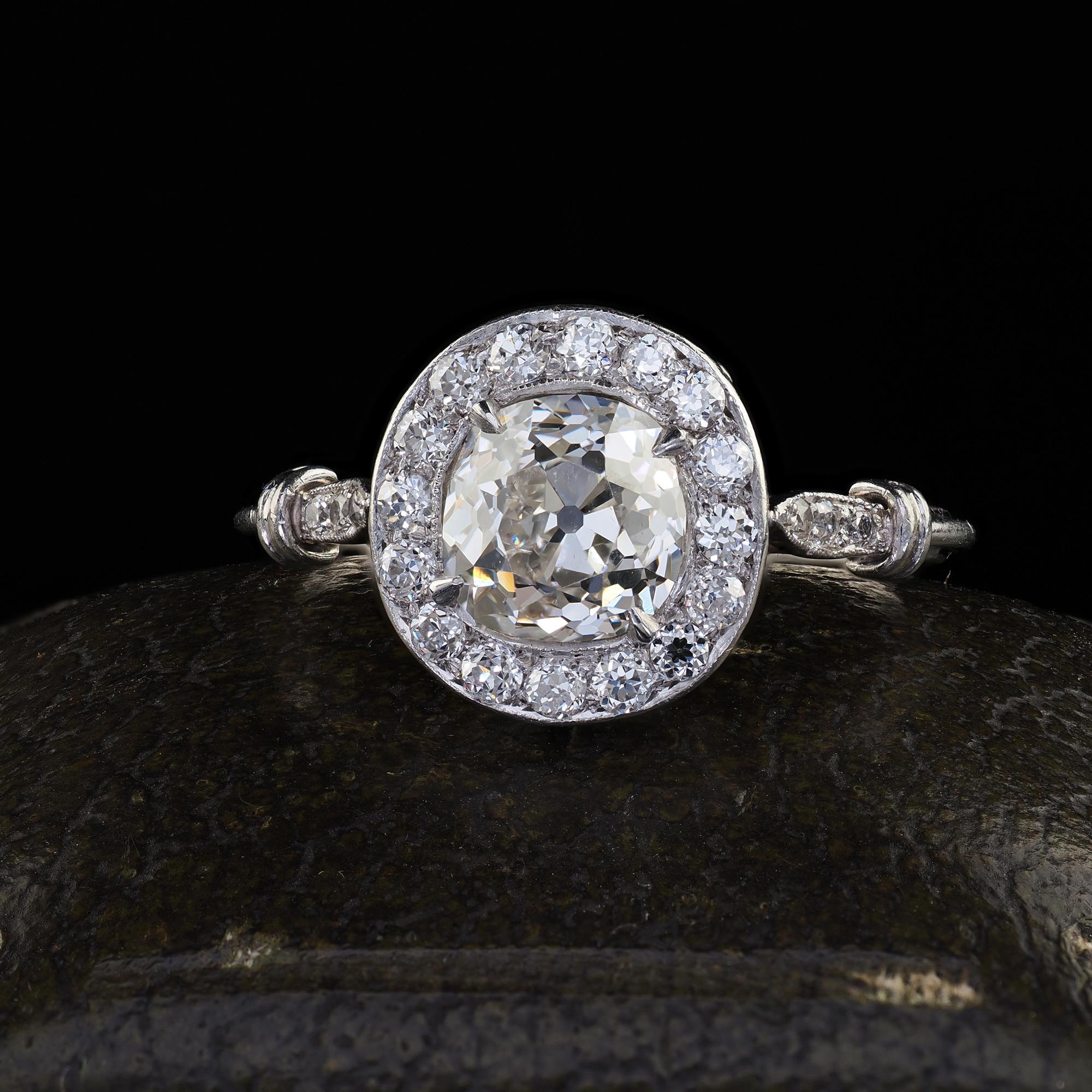 Beautiful Antique Edwardian Platinum Old Mine Diamond and Halo Engagement Ring - GIA. This incredible Edwardian old mine diamond engagement ring is crafted in platinum. This beautiful ring features an old mine cut diamond in the center that has a