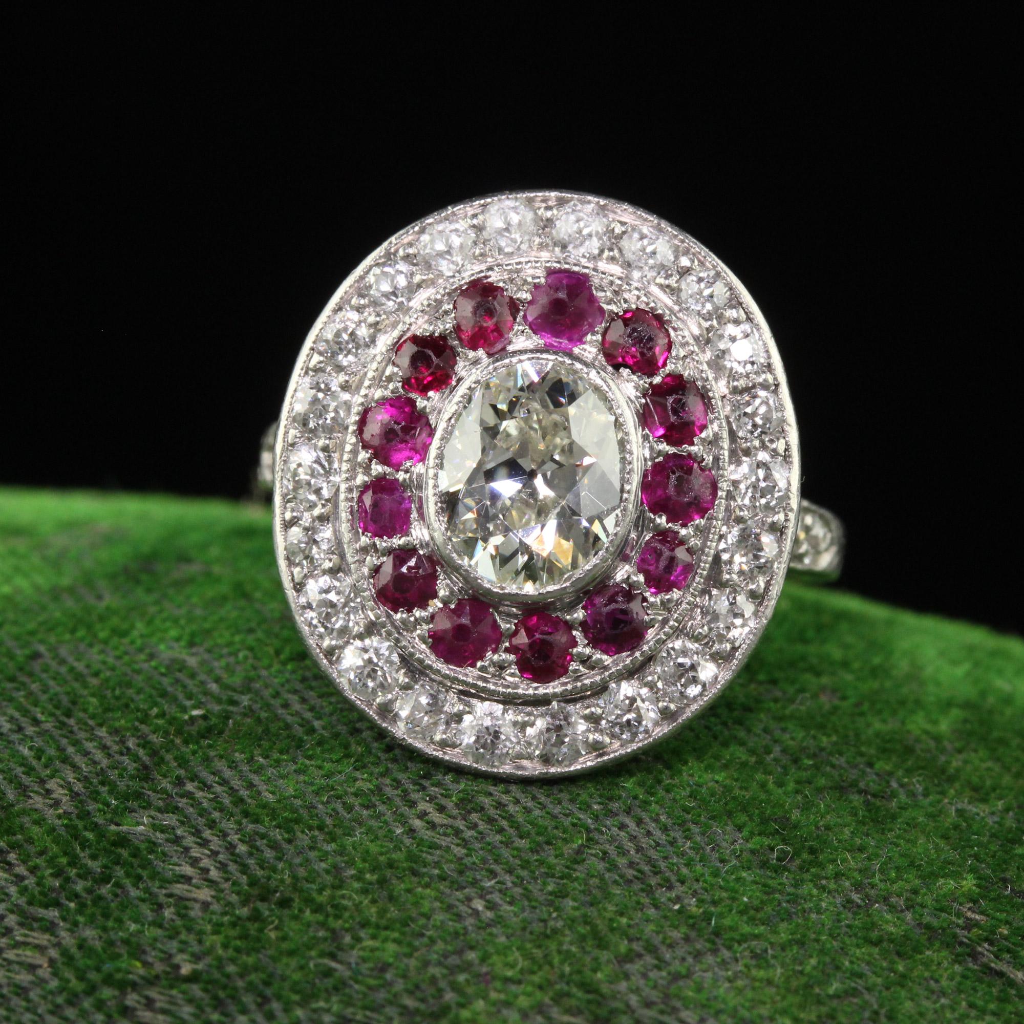 Beautiful Antique Edwardian Platinum Old Mine Oval Diamond and Ruby Engagement Ring. This incredible Edwardian Old Mine Diamond engagement ring is crafted in platinum. This gorgeous ring features an old oval cut diamond in the center and is