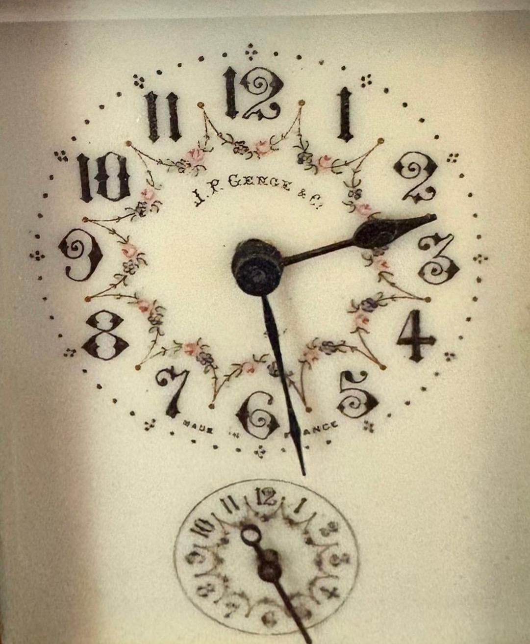 Antique Edwardian quality brass and champleve enamelled carriage clock  having a quality brass case with bevelled edge glass and champleve enamelled corners, enamel dial with original hands and subsidiary alarm dial, 8 day movement.

A pretty
