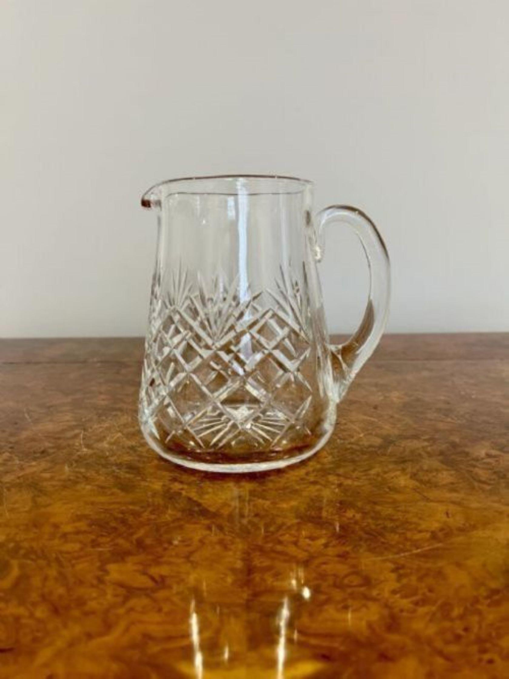 Antique Edwardian quality cut glass water jug having a quality antique cut glass water jug with a shaped handle 