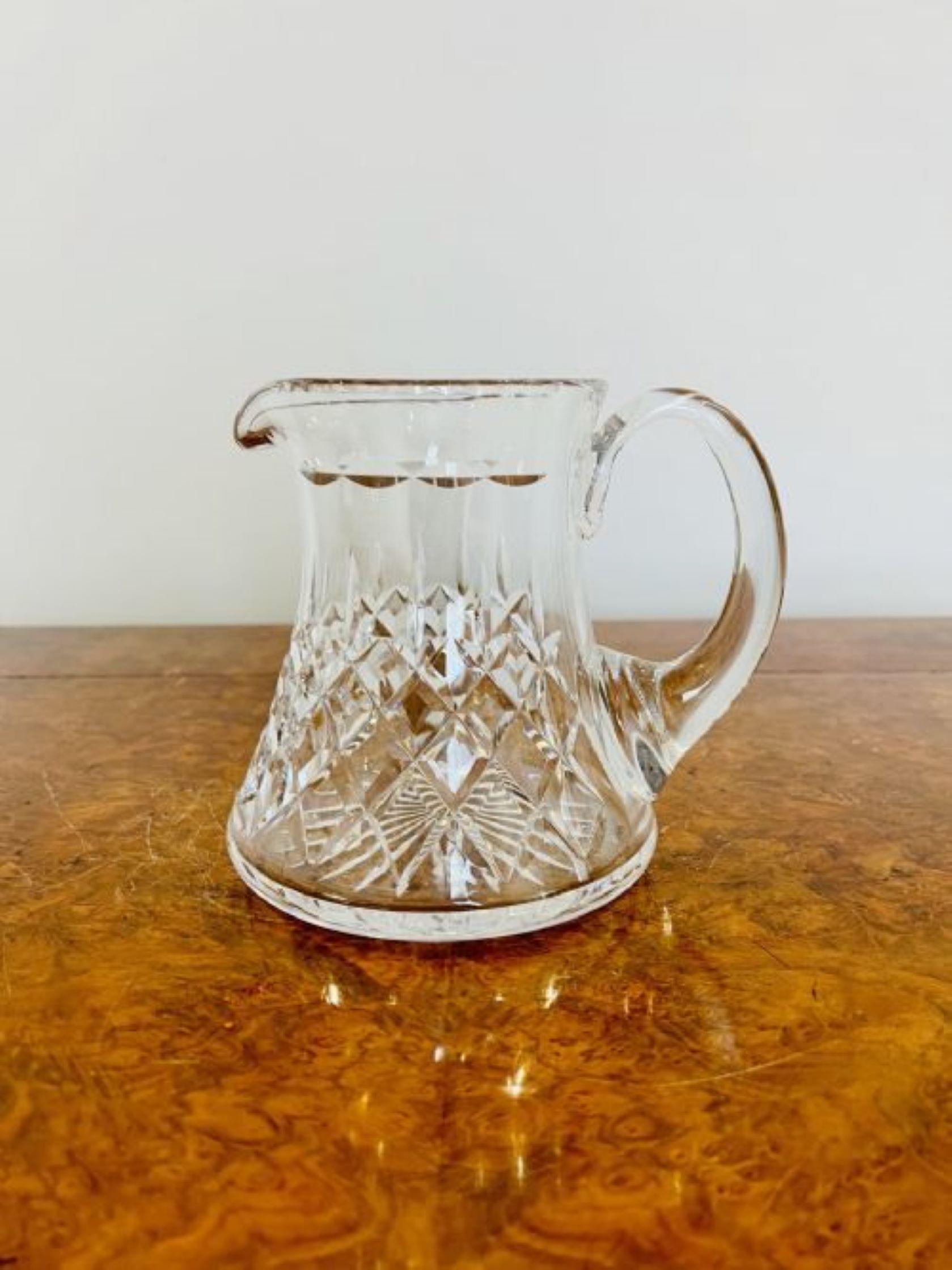 Antique Edwardian quality cut glass water jug having a quality antique cut glass water jug with a shaped handle 