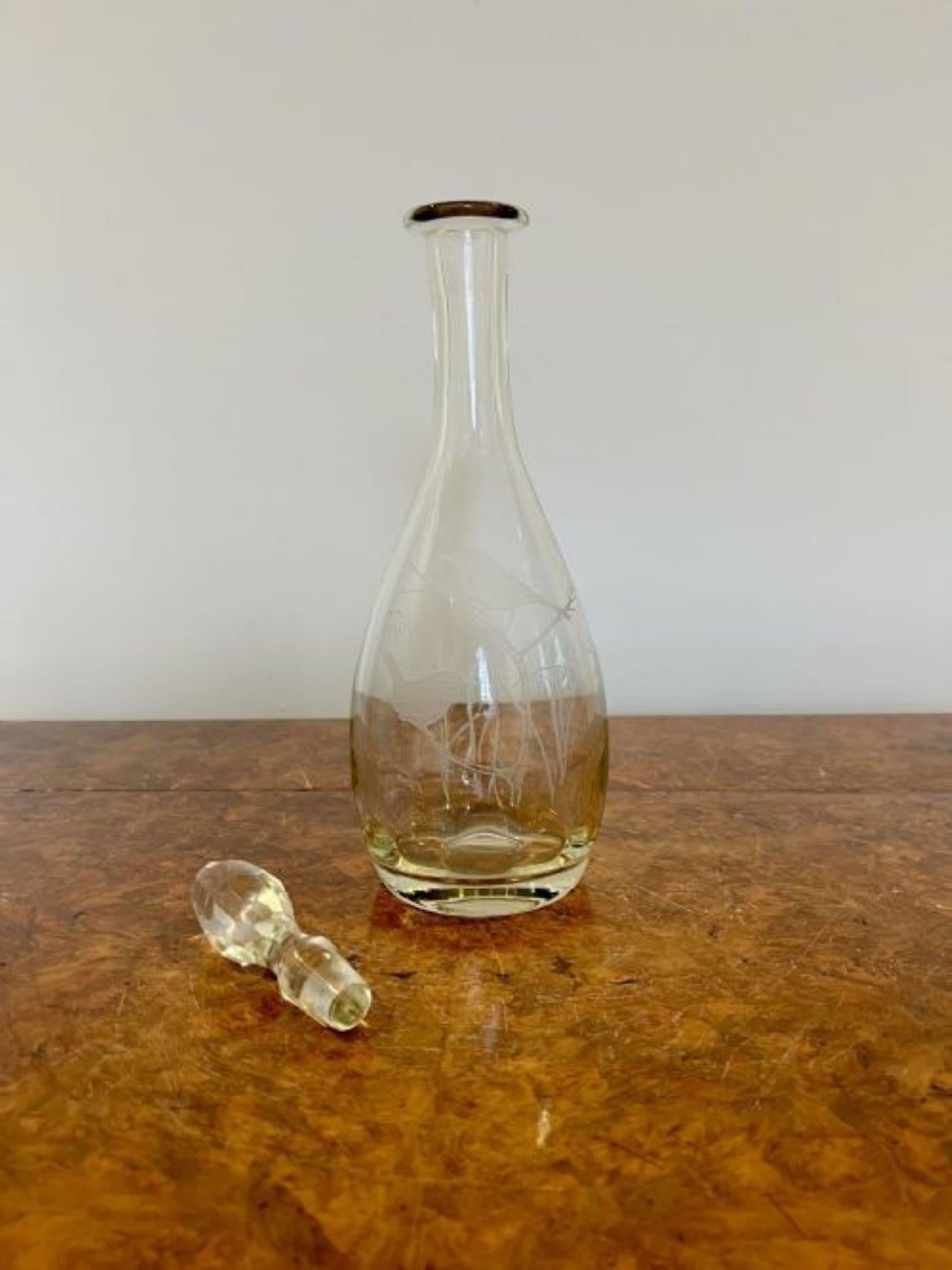 Antique Edwardian quality engraved decorated glass decanter having a quality antique Edwardian decanter engraved with birds and trees with the original cut glass stopper 