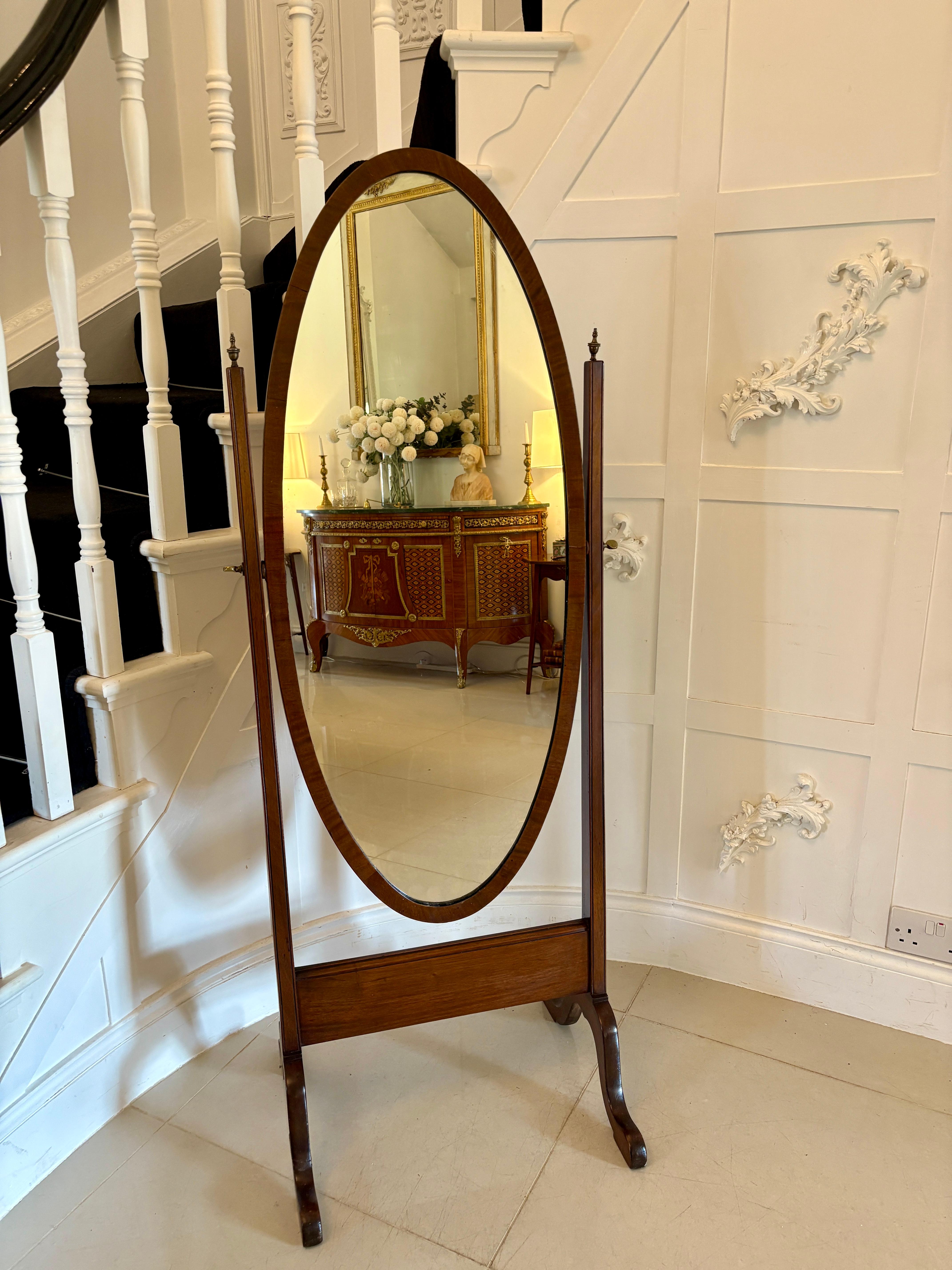 Antique Edwardian quality mahogany cheval mirror having a quality mahogany oval frame with the original bevelled edge mirror supported by elegant square mahogany columns standing on shaped cabriole legs united by a mahogany stretcher 

A delightful