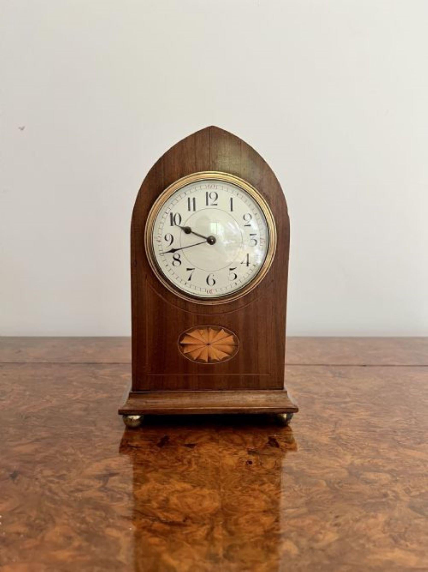 Lovely antique Edwardian quality mahogany inlaid satinwood mantle clock having a lovely antique Edwardian quality mahogany mantle clock with inlaid satinwood detail to the case, shaped at the top of the case, having a white enamel dial and the